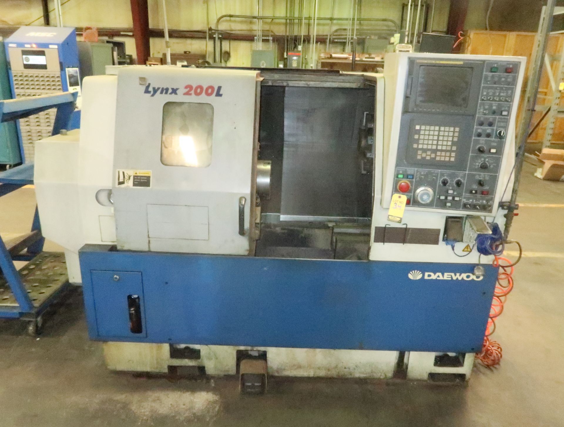 2001 DAEWOO LYNX 200LC CNC LATHE, 12-STATION TURRET, TAIL STOCK, FANUC 21iT CONTROL, 3-JAW CHUCK,