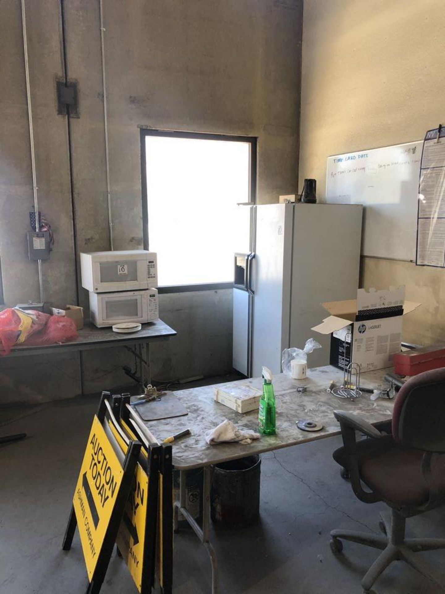 LOT: Contents of Lunch Room Area- Fridge, (2) Microwaves, (2) Tables, and Chairs