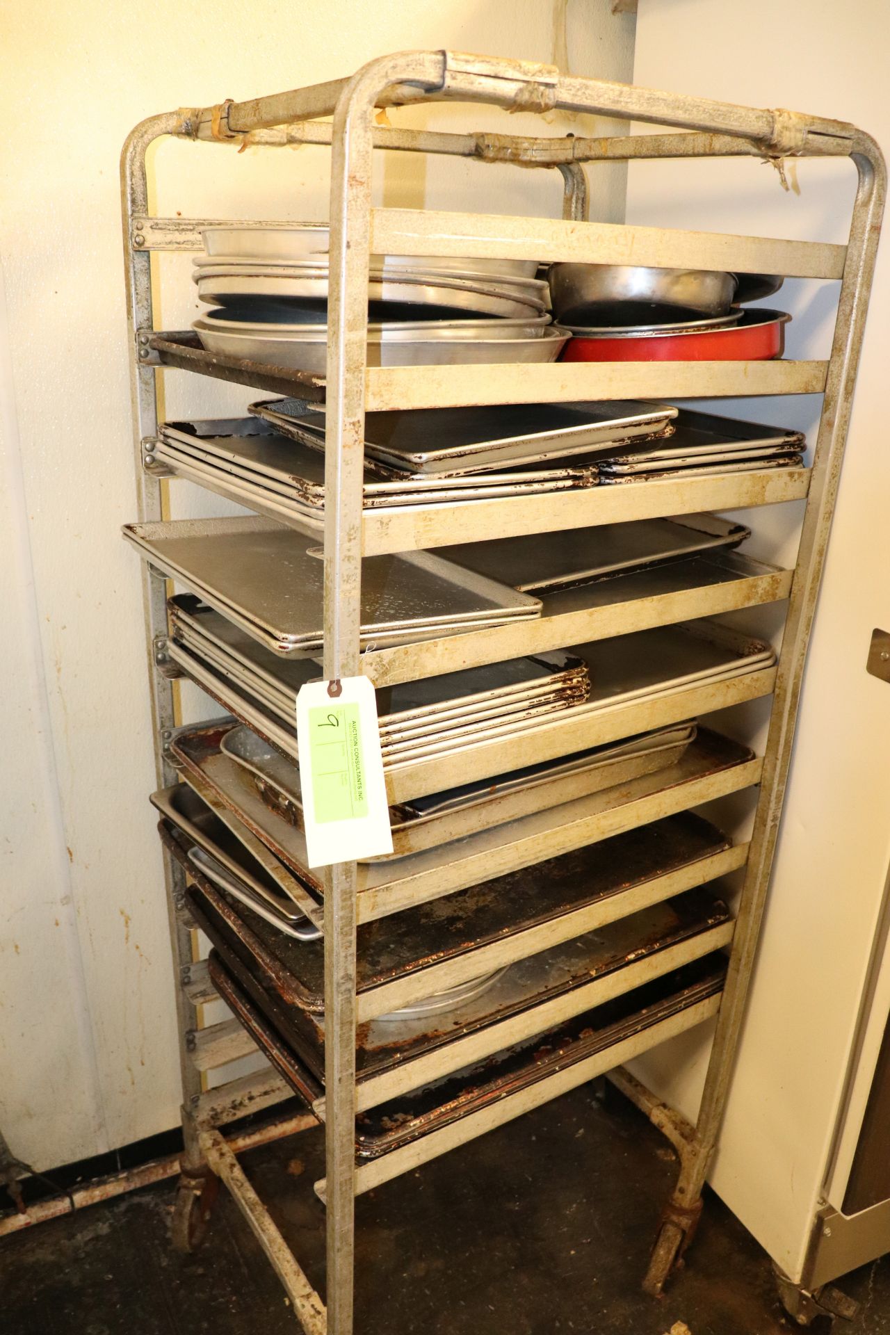 Tray rack on casters and sheet pan rack with contents