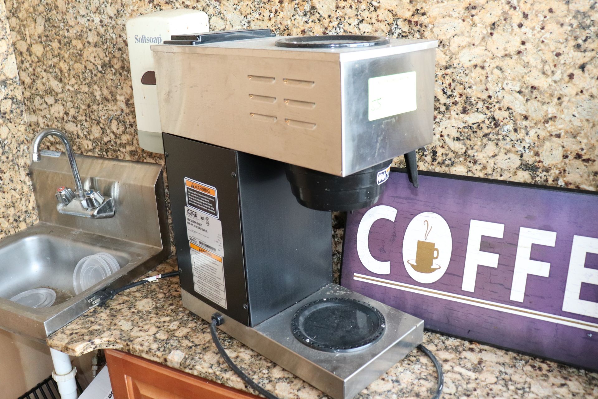 Bunn coffee brewer and coffee sign