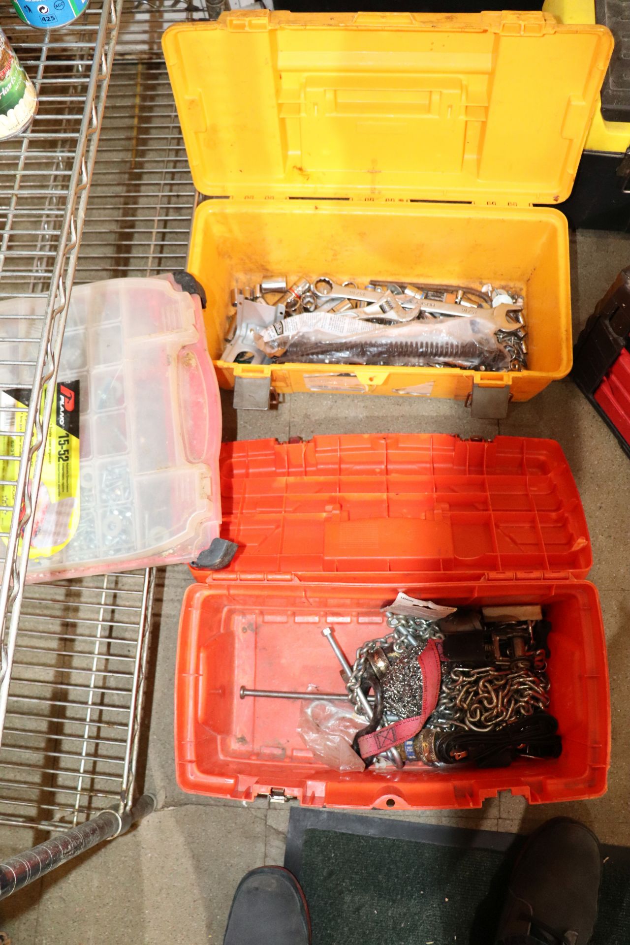 Two toolboxes and one container of fasteners, toolboxes have straps, chains,