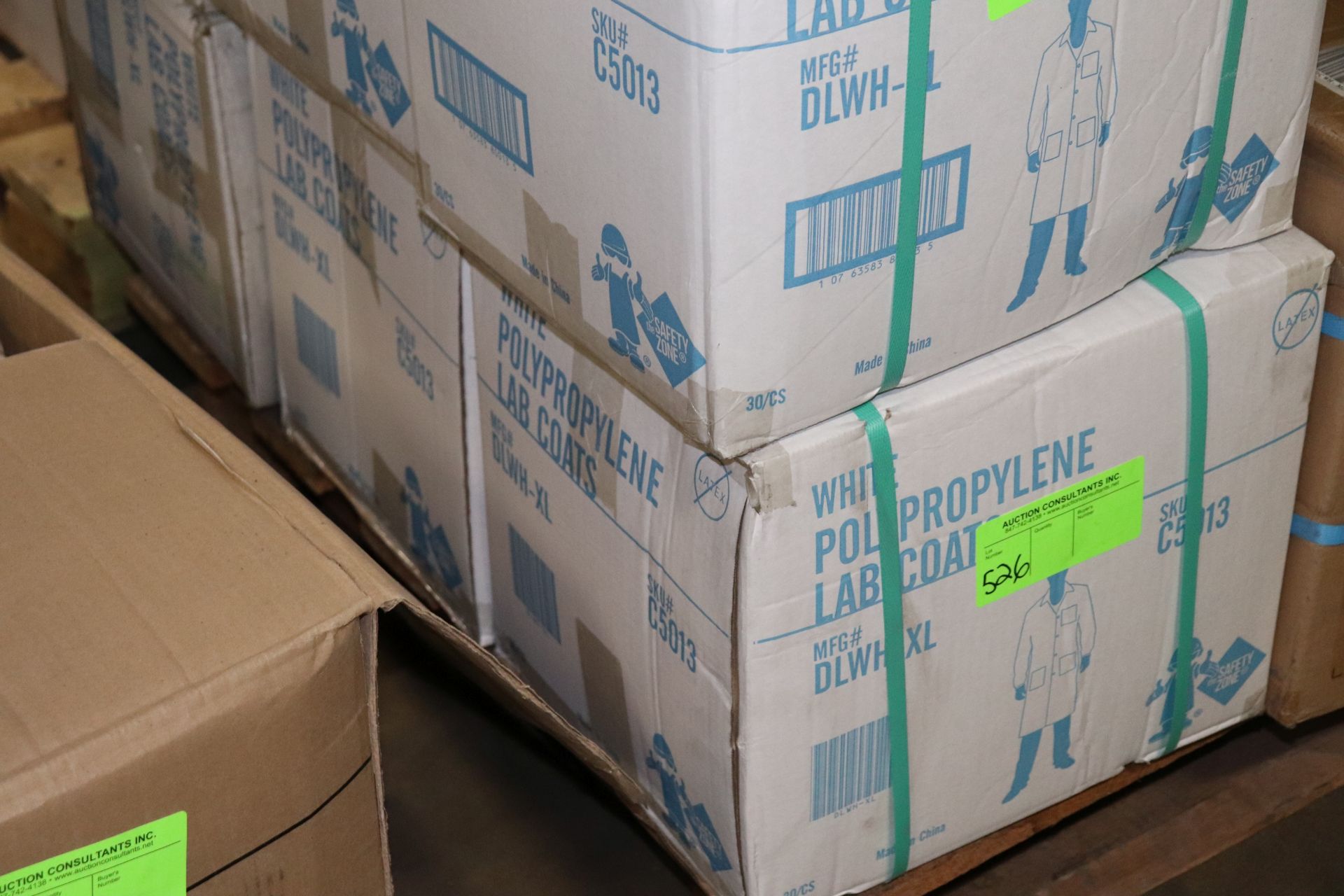 Three boxes of white polypropylene lab coats, 30 per case