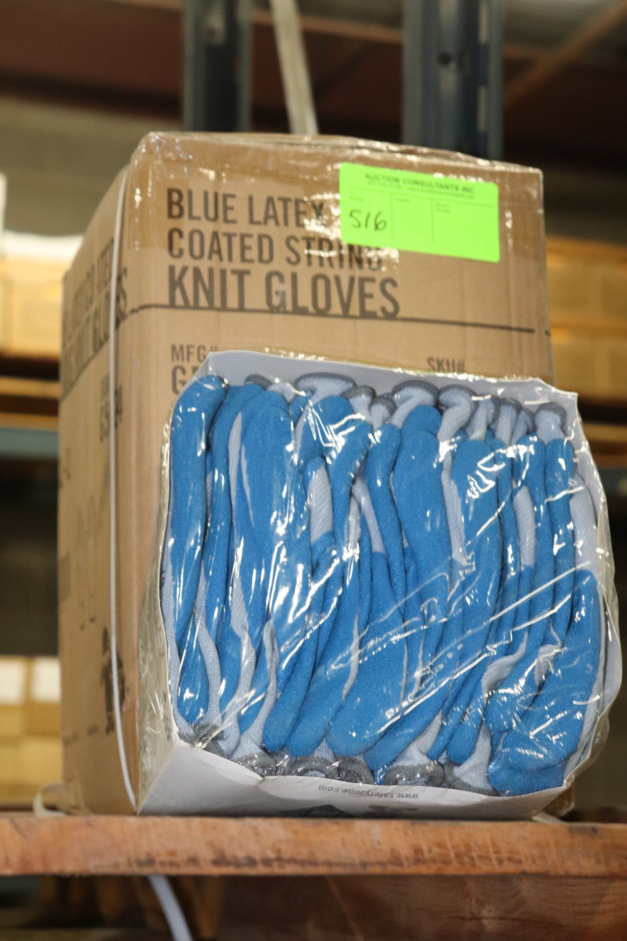 Seventy-eight pairs of blue latex coated string knit gloves