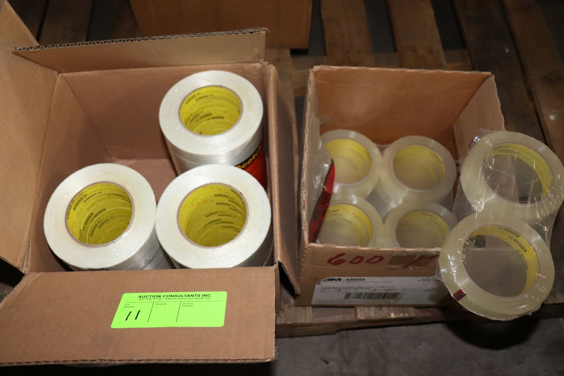 Two partial boxes of Scotch brand filament tape and premium transparent film tape