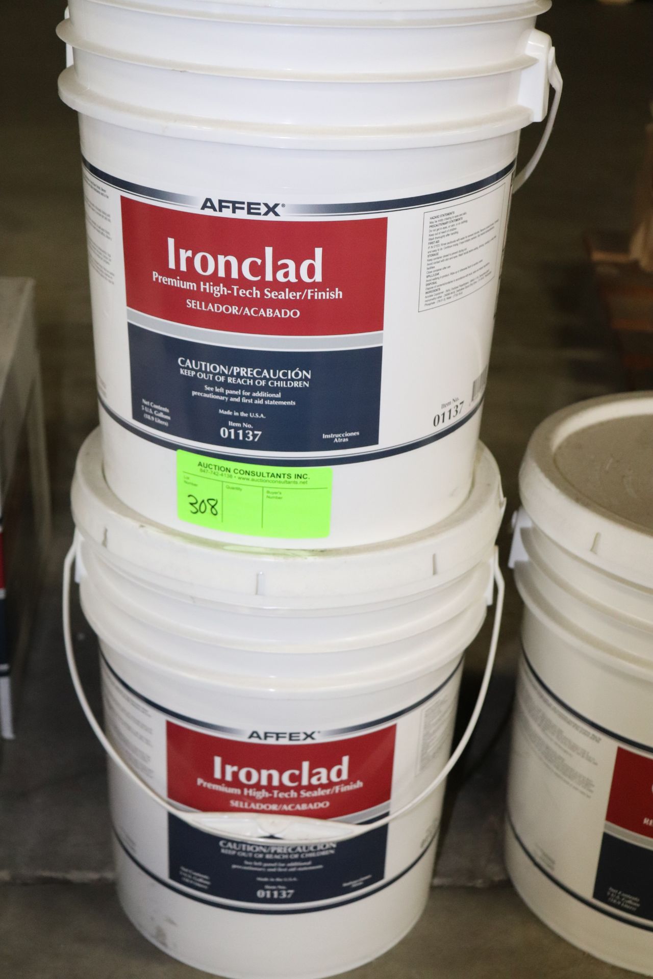 Two buckets of Iron Clad Premium High Tech sealer finish