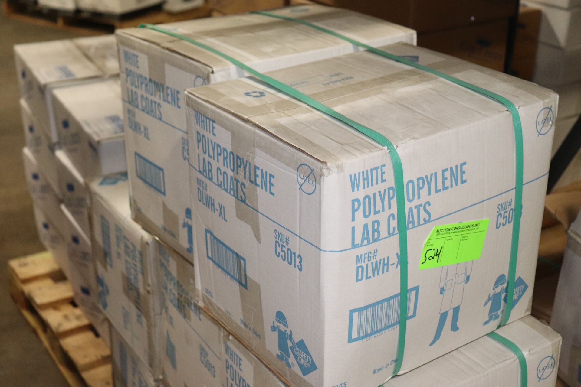 Two boxes of white polypropylene lab coats, 30 per case