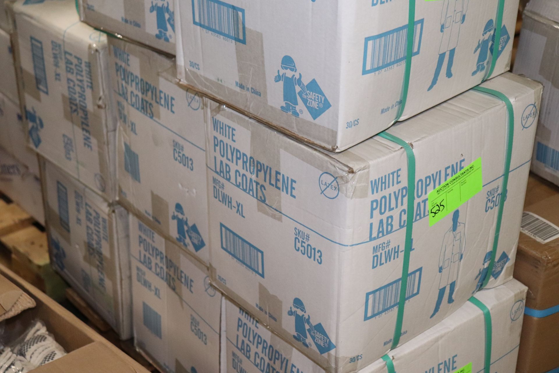 Three boxes of white polypropylene lab coats, 30 per case