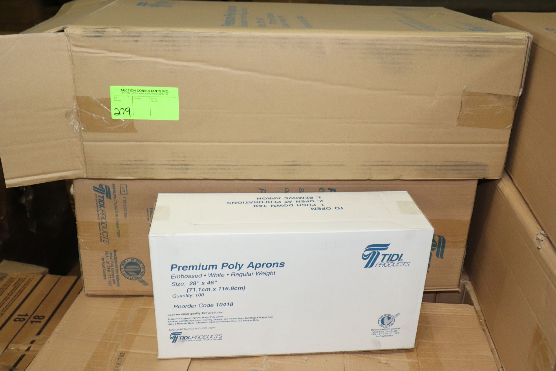 Partial box of Tidi Products premium poly aprons