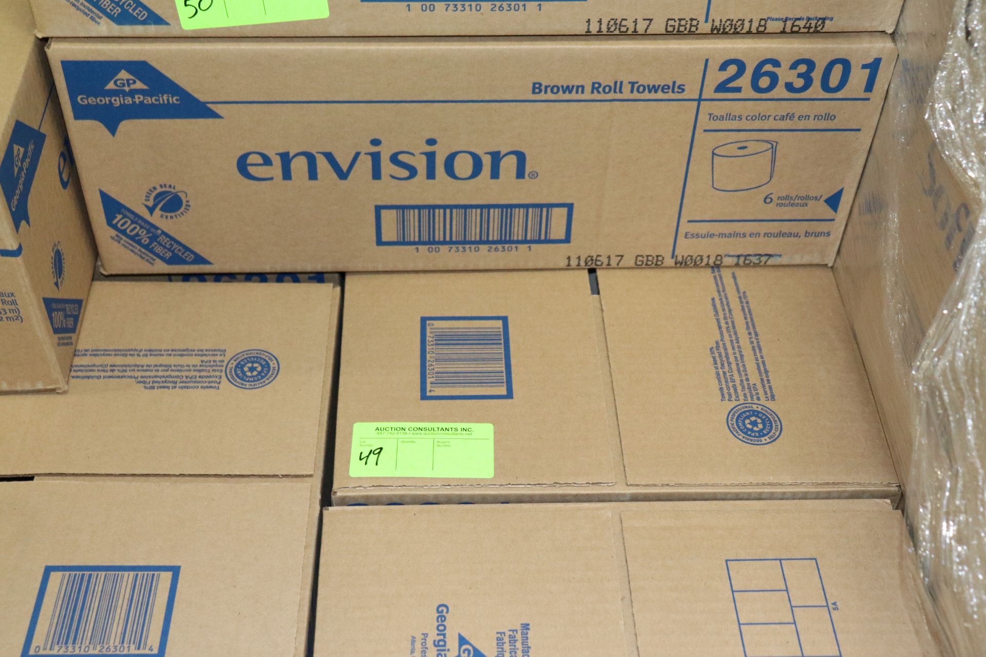 Three boxes of Envision brown roll towels, 6 rolls in a box