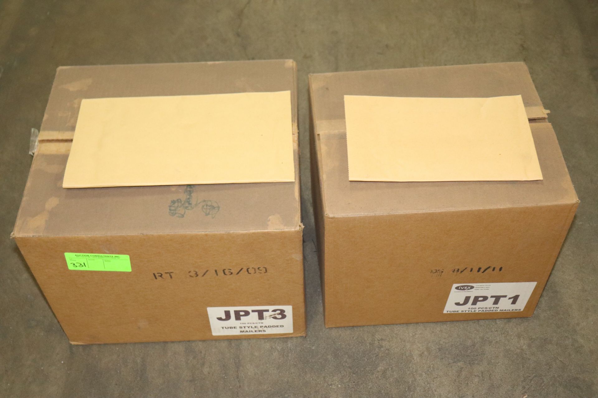 Two boxes of padded mailers, tube style, 100 per box