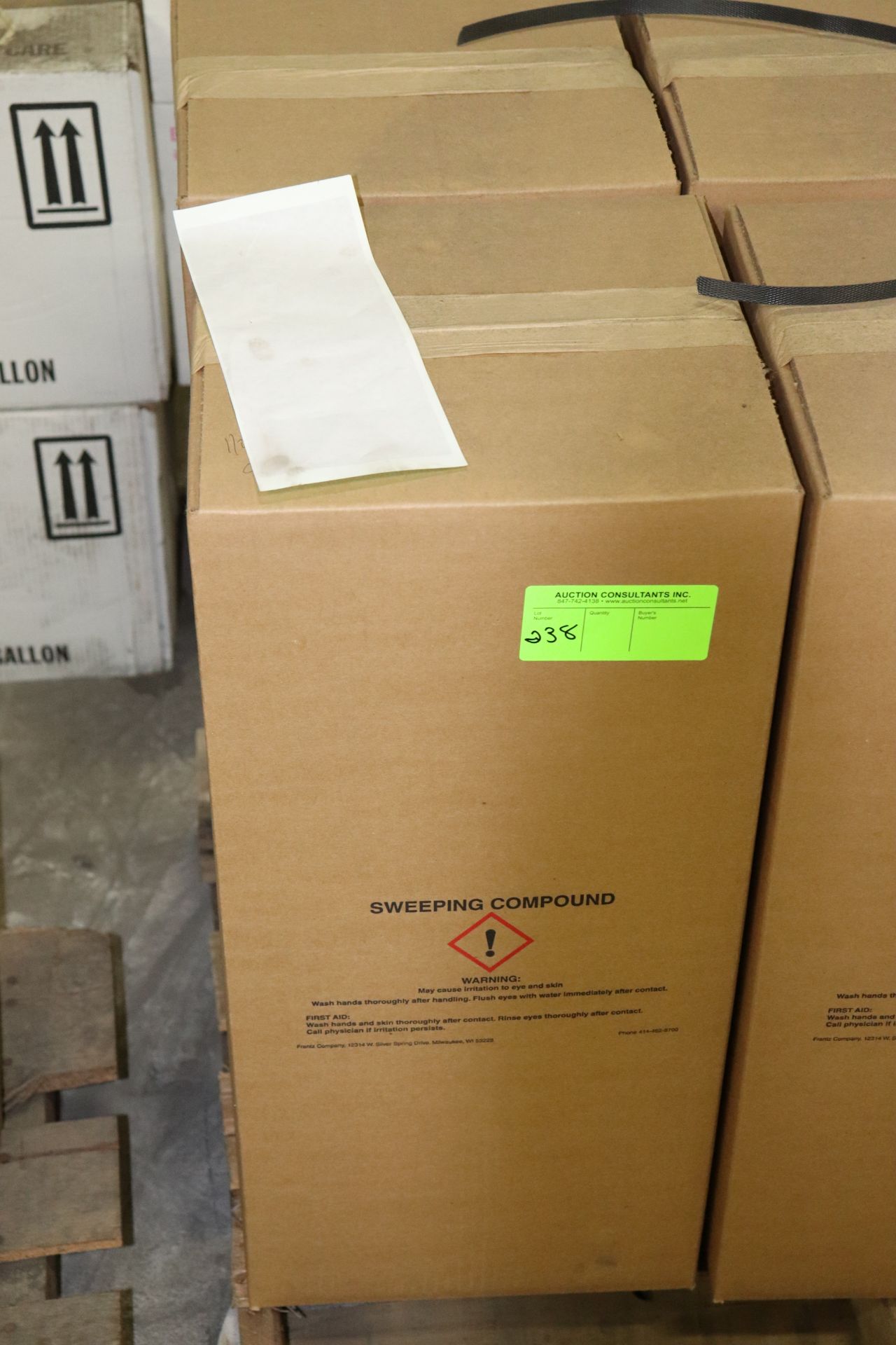 Two boxes of sweeping compound