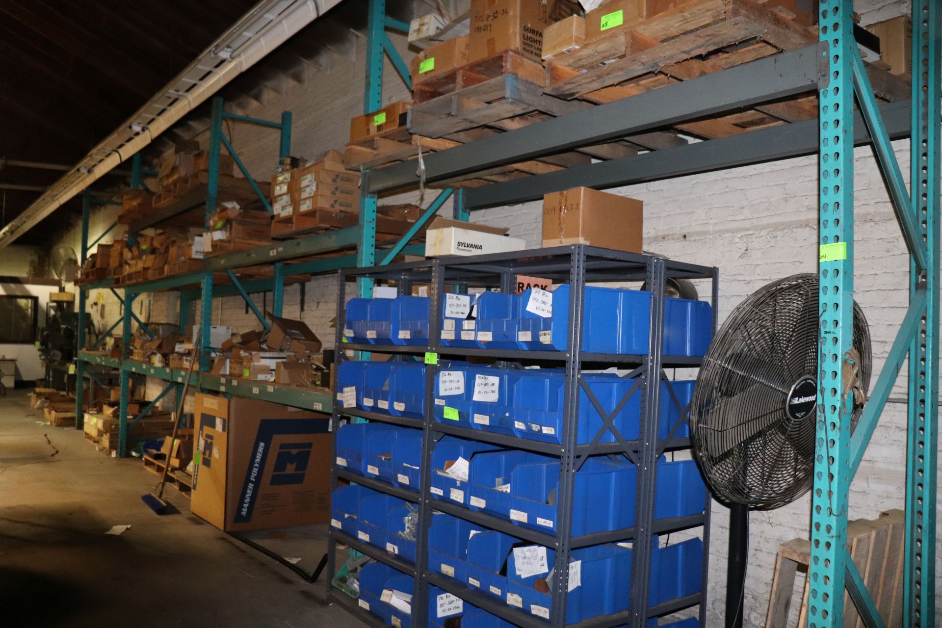 Four sections of pallet racking, marked for late removal