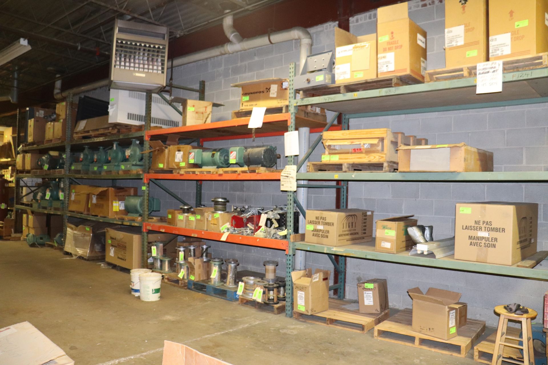 Four sections of pallet racking, marked for late removal