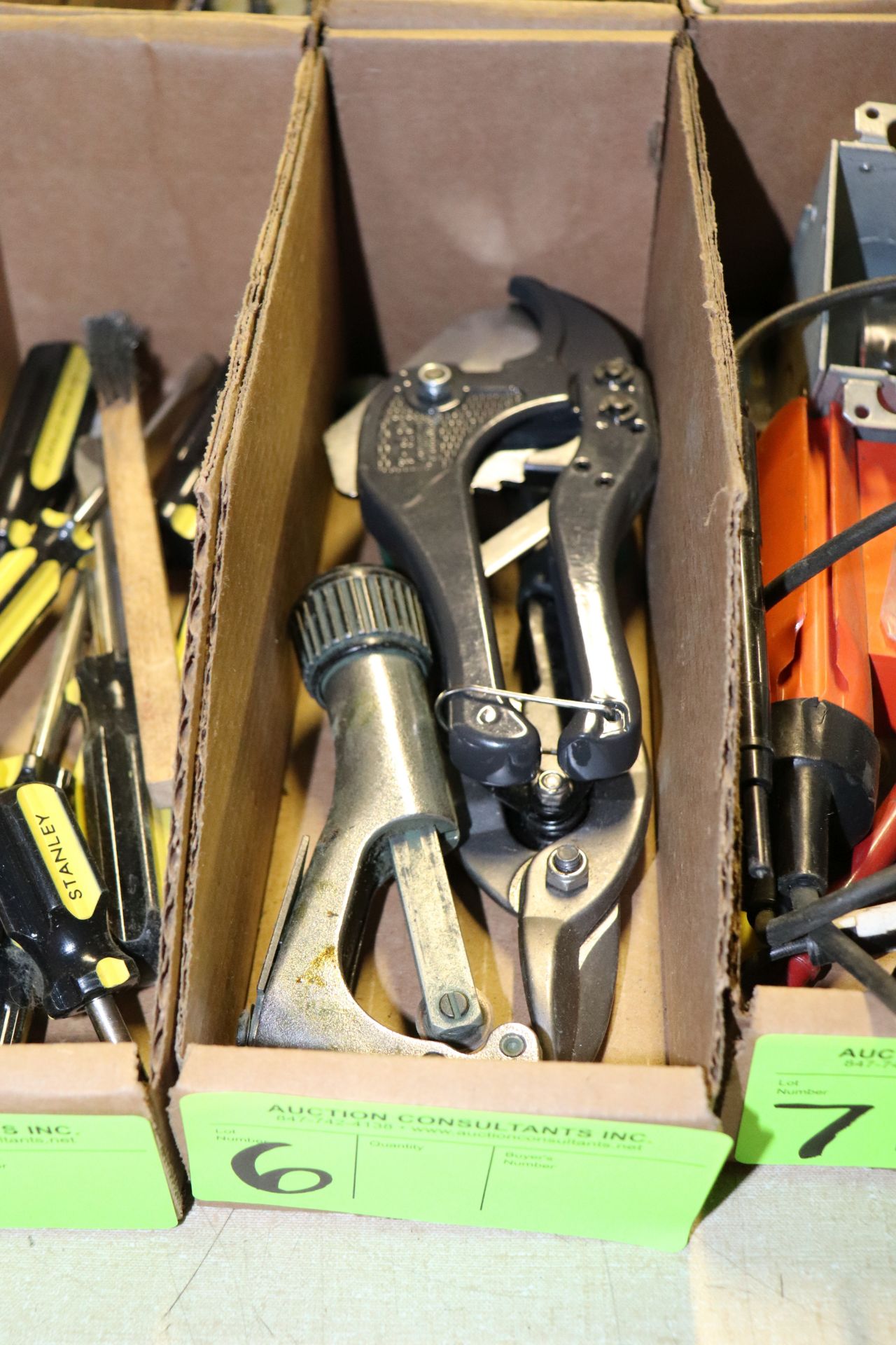 Two tin snips and a pipe cutter