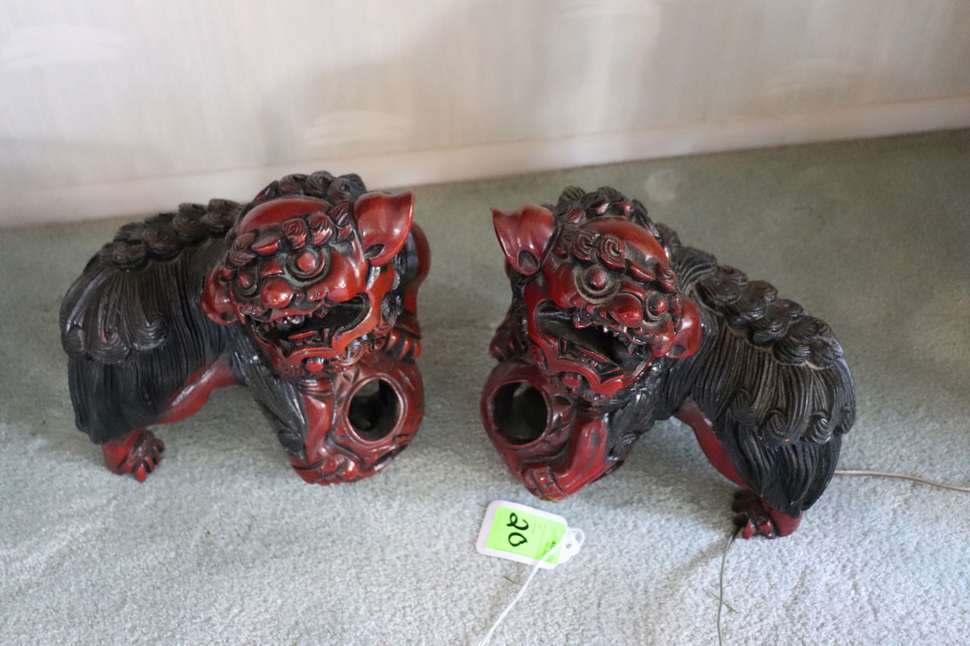 Two carved foo dogs