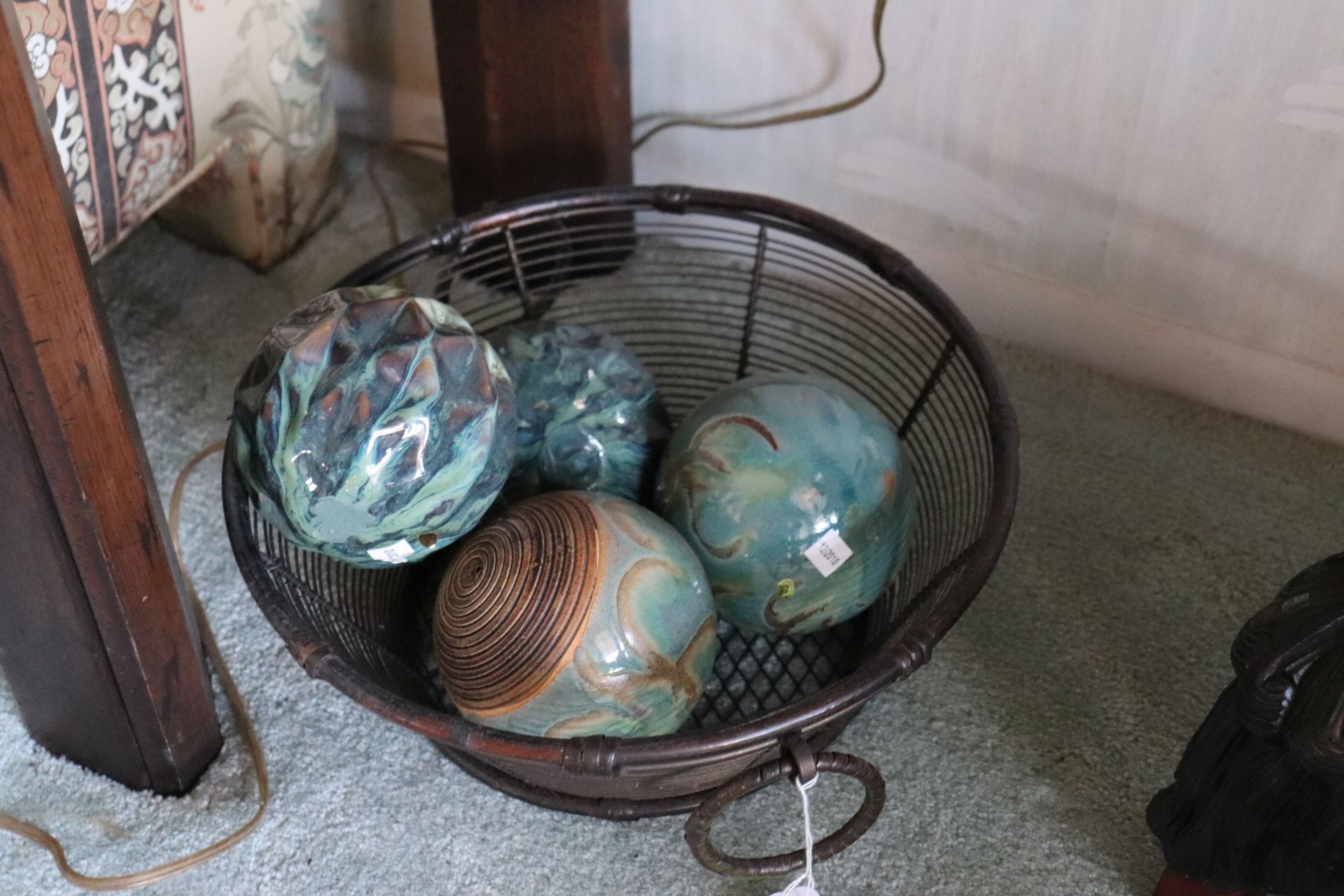 Decorative basket with ceramic spheres