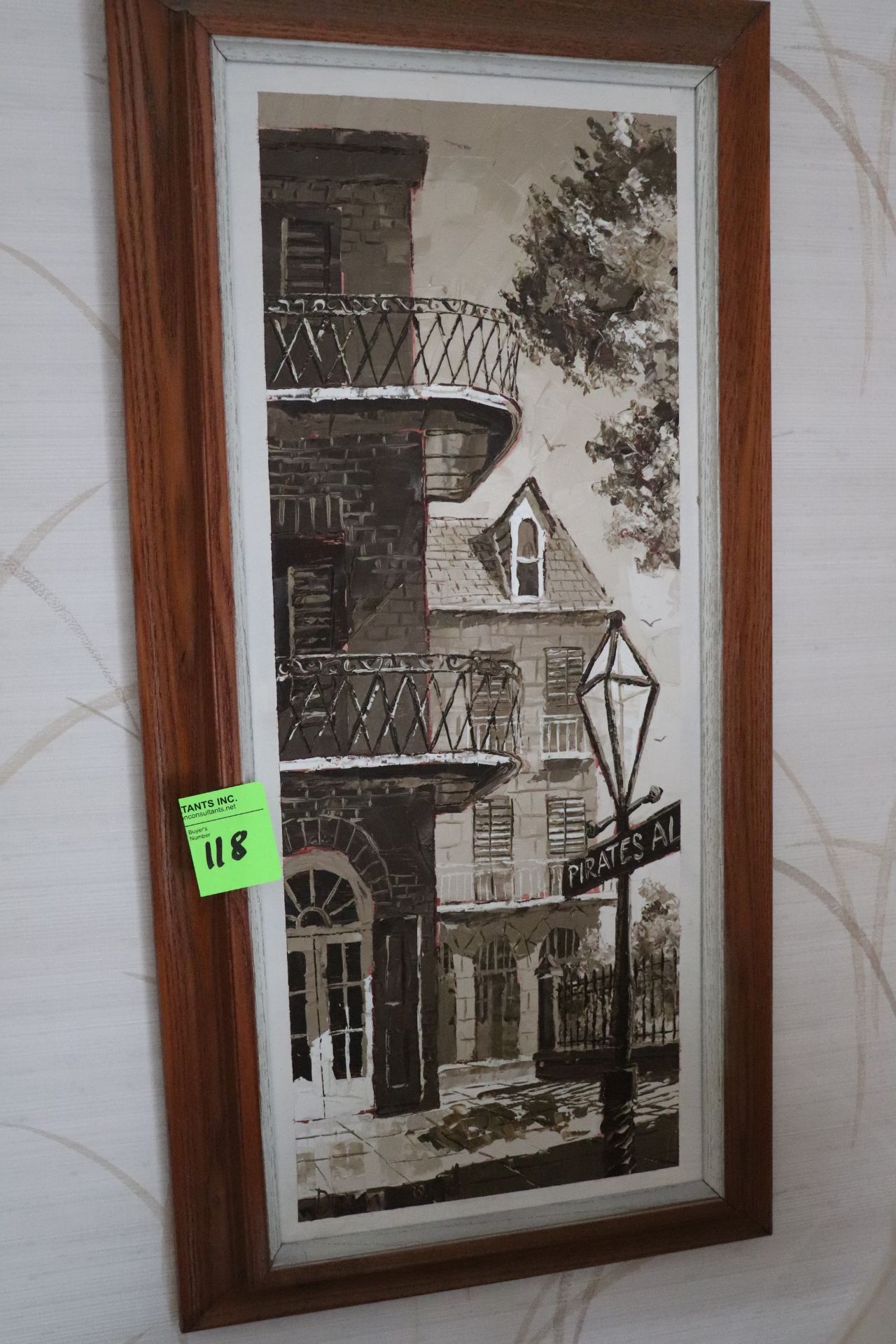 Framed painting of a New Orleans town scene