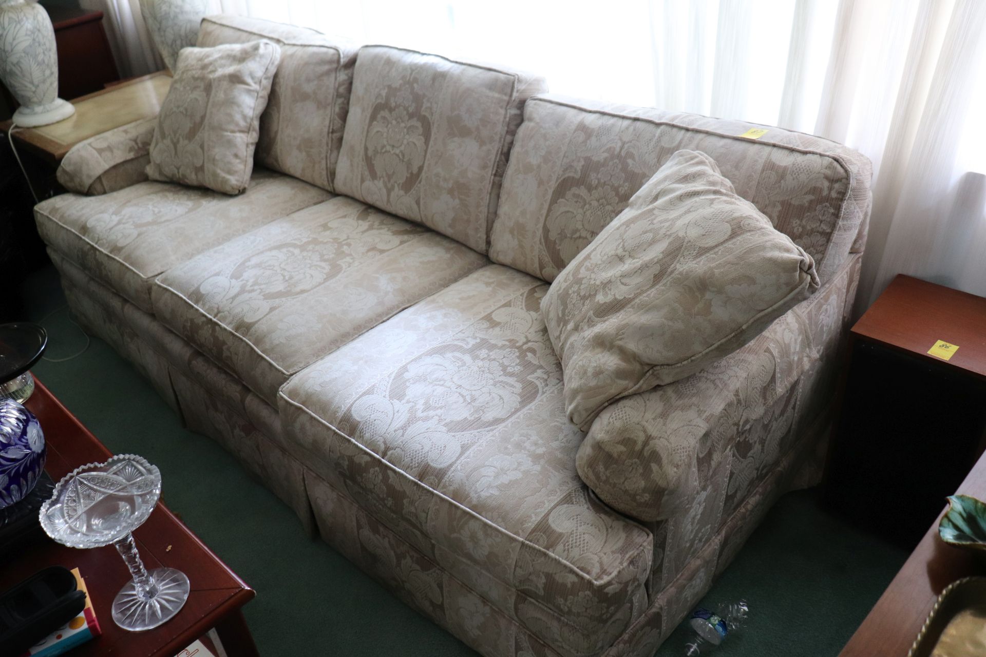 Woodmark beige floral upholstered three-cushion sofa, approximate height 30", length 78"