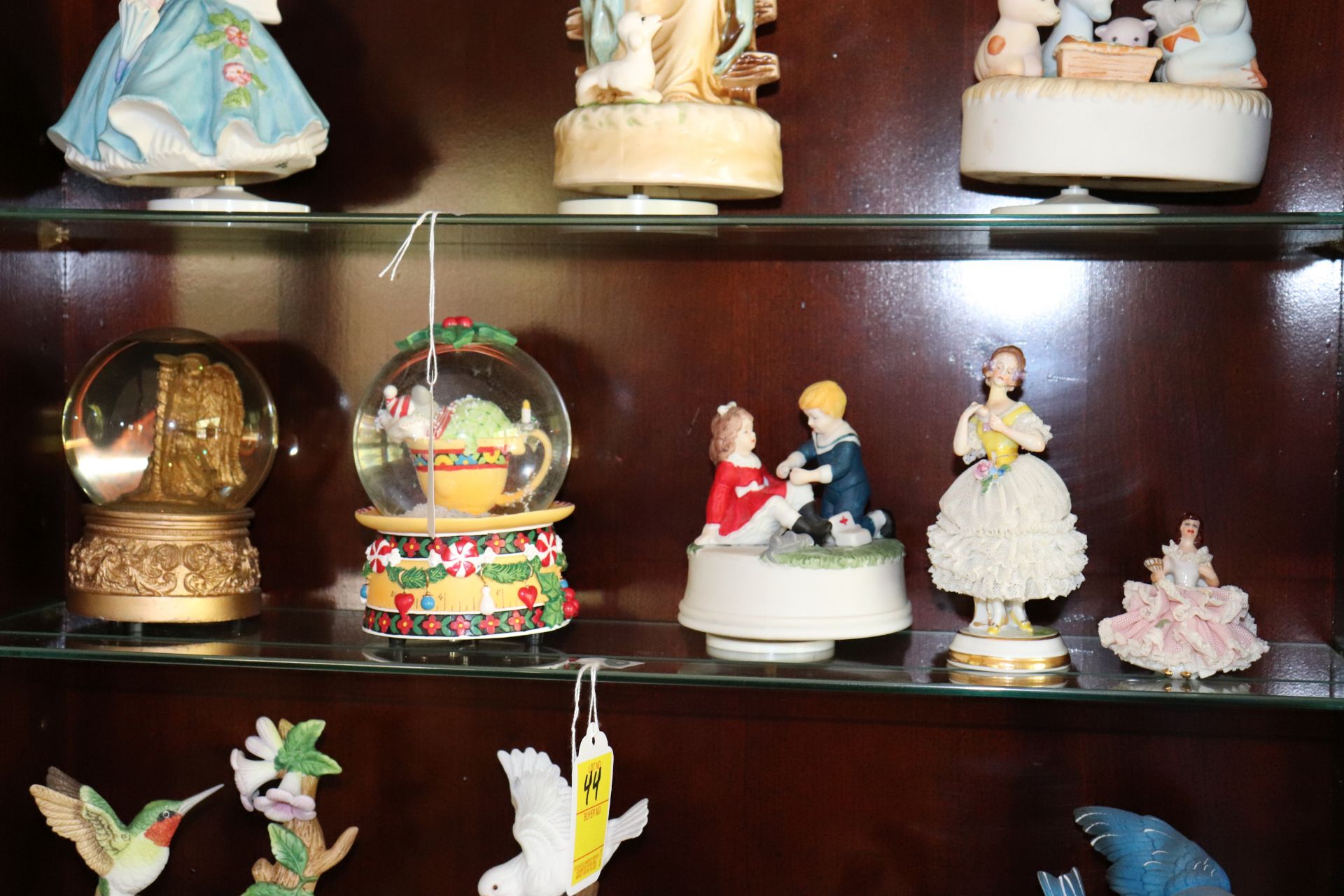 Group: two snow globes, musical figurine, and two Dresden style ballerina figurines