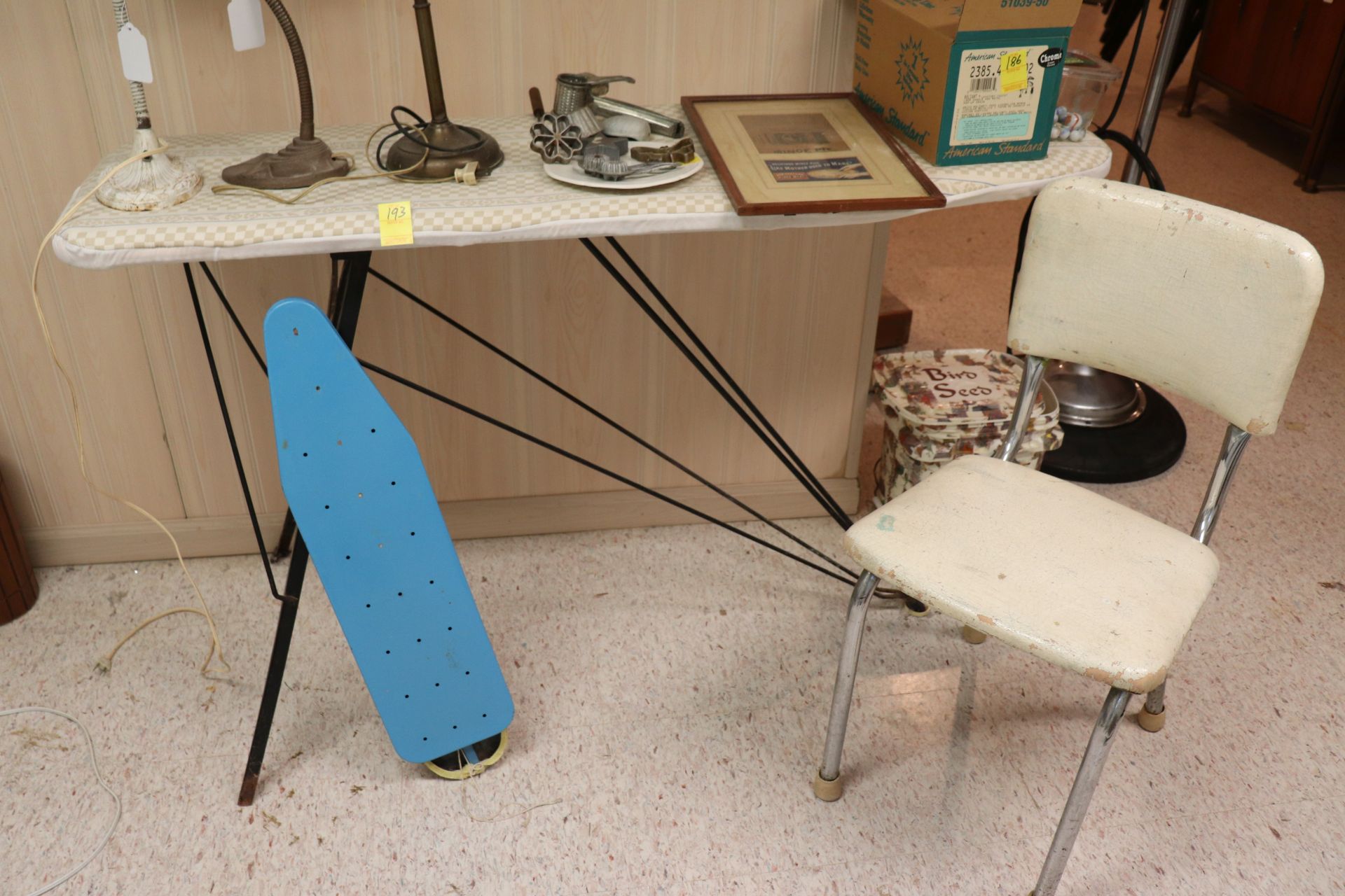 Group: two ironing boards and one chair