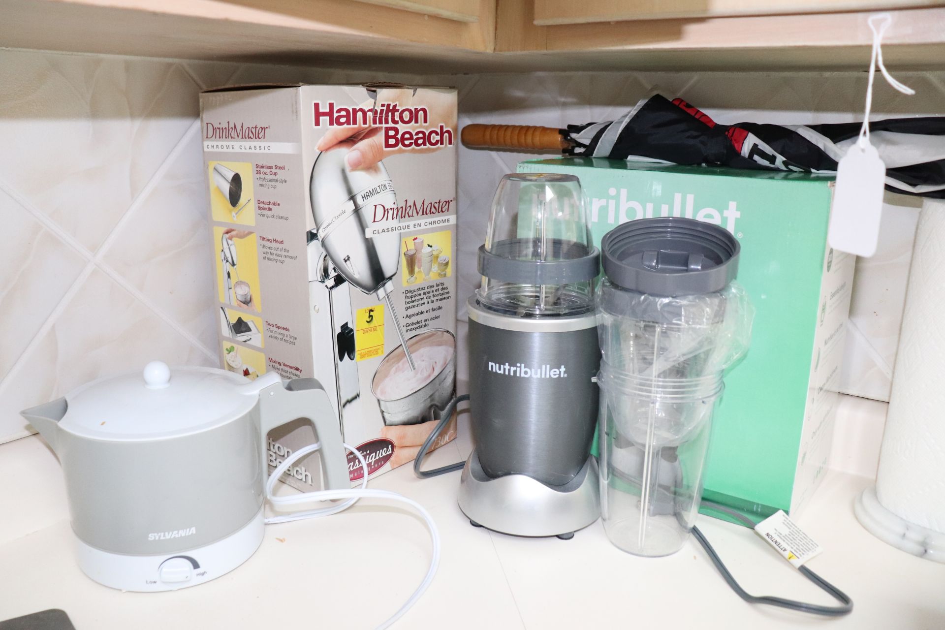 Nutri Bullet mixer, Hamilton Beach mixer, and Sylvania electric kettle