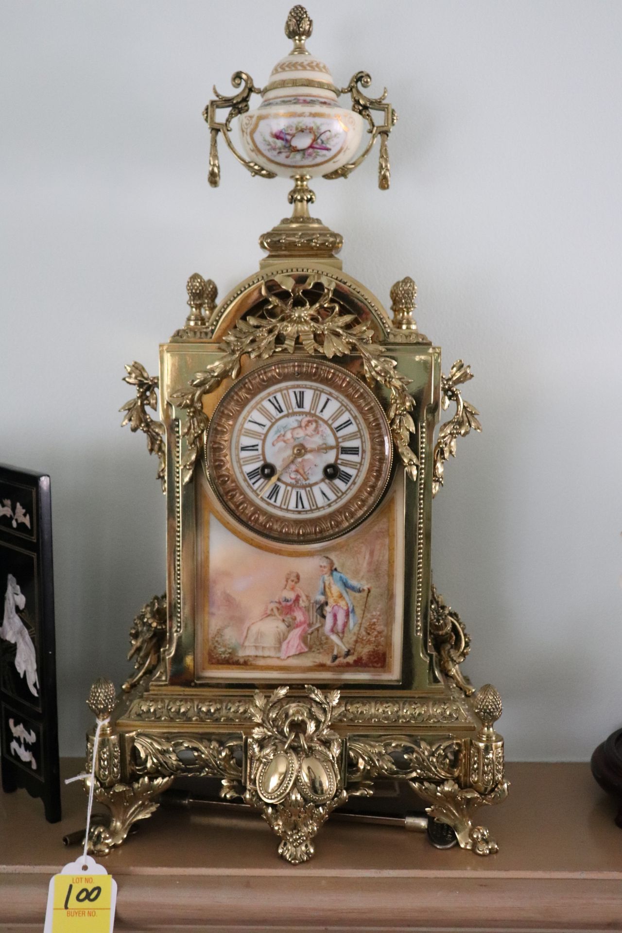 Tiffany & Company New York branch Louis XV style gilt brass and porcelain mantle clock having key wo