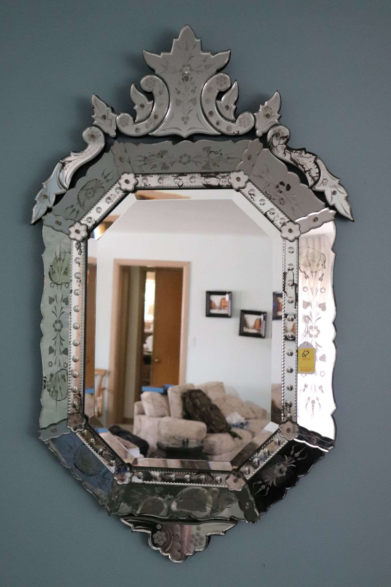 Venetian beveled glass wall mirror having etched red floral and leaf decoration, approximate size 48