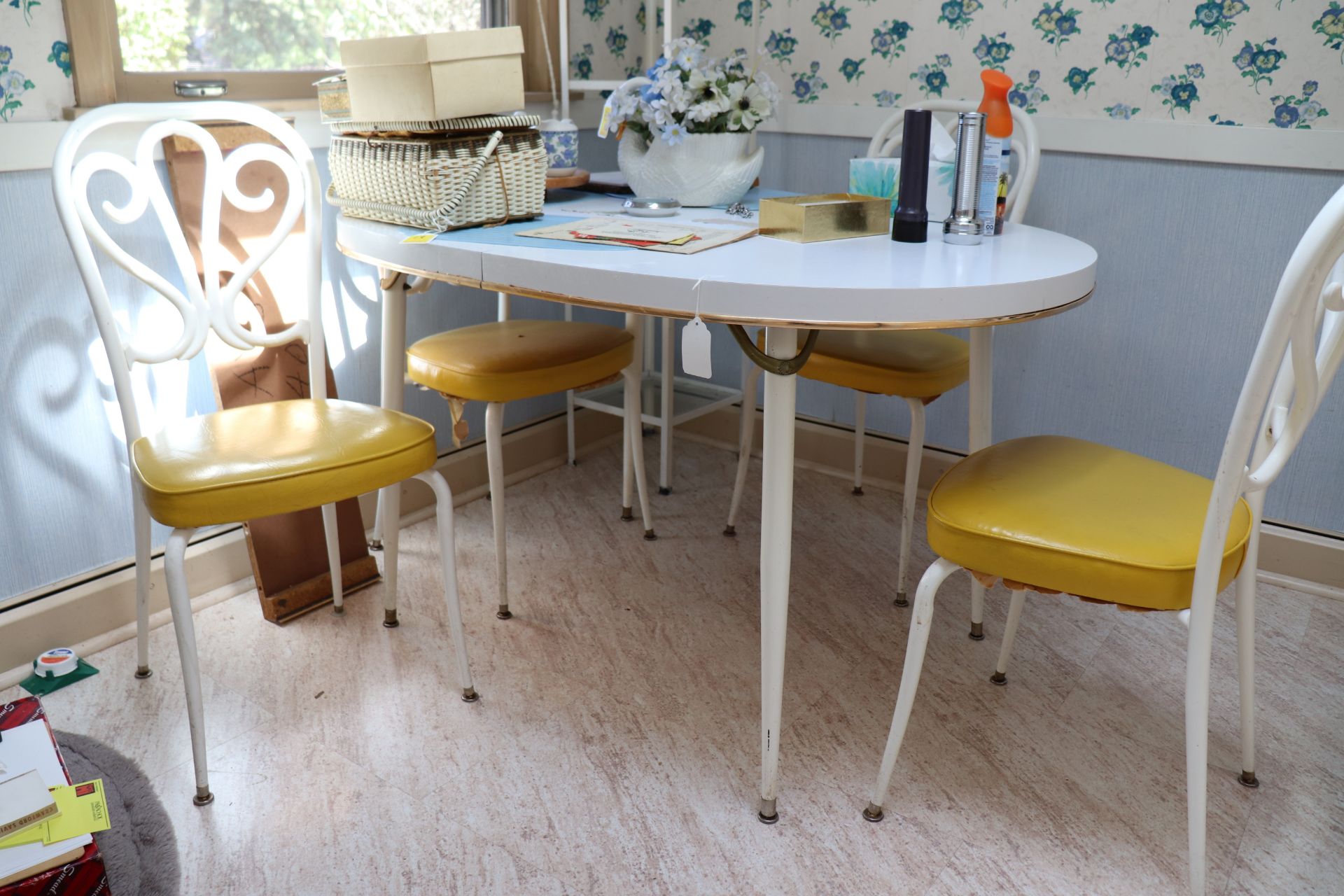 Kitchen table with four chairs and a leaf