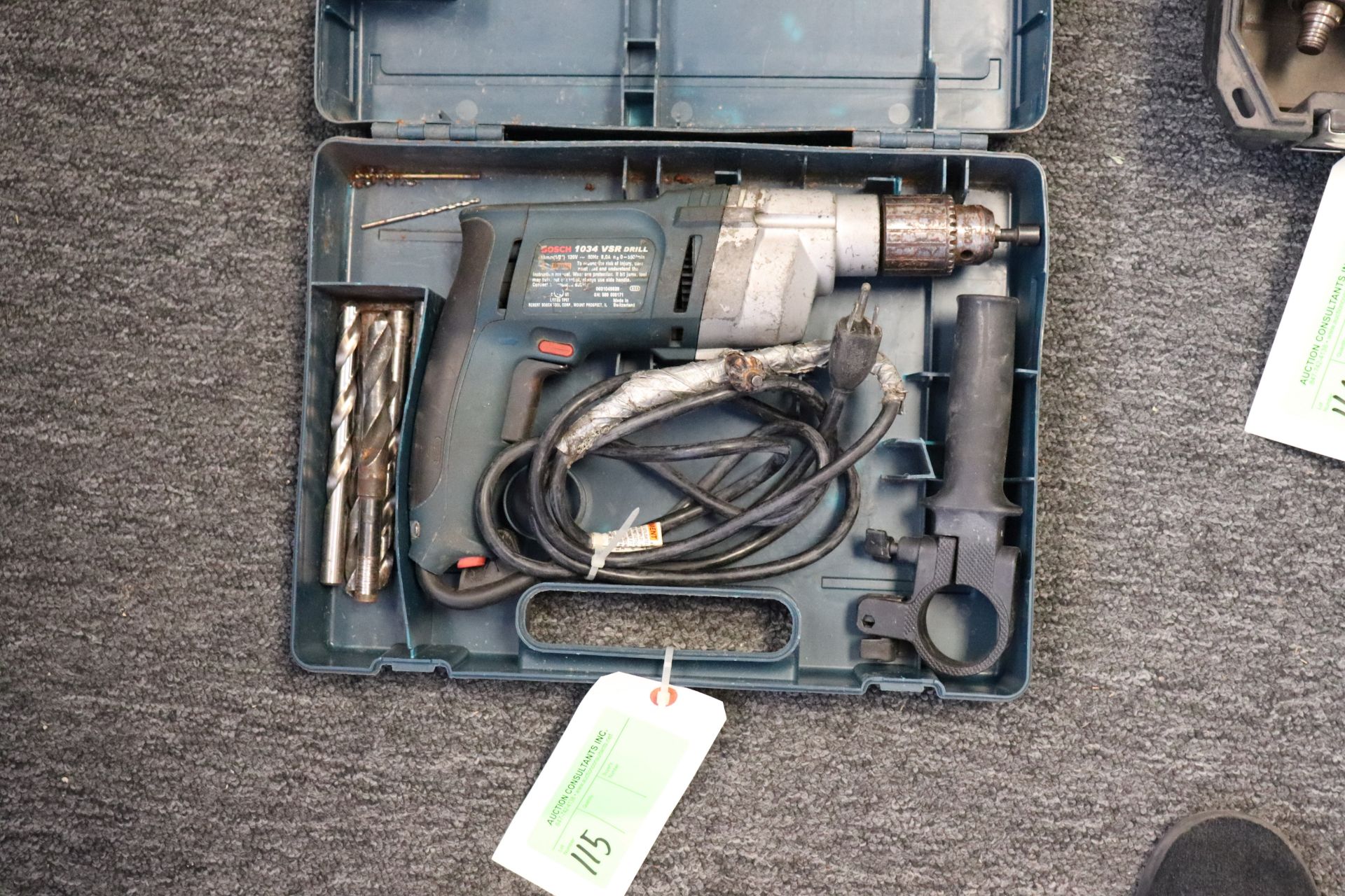 Bosch 1034 VSR electric drill with bits and case