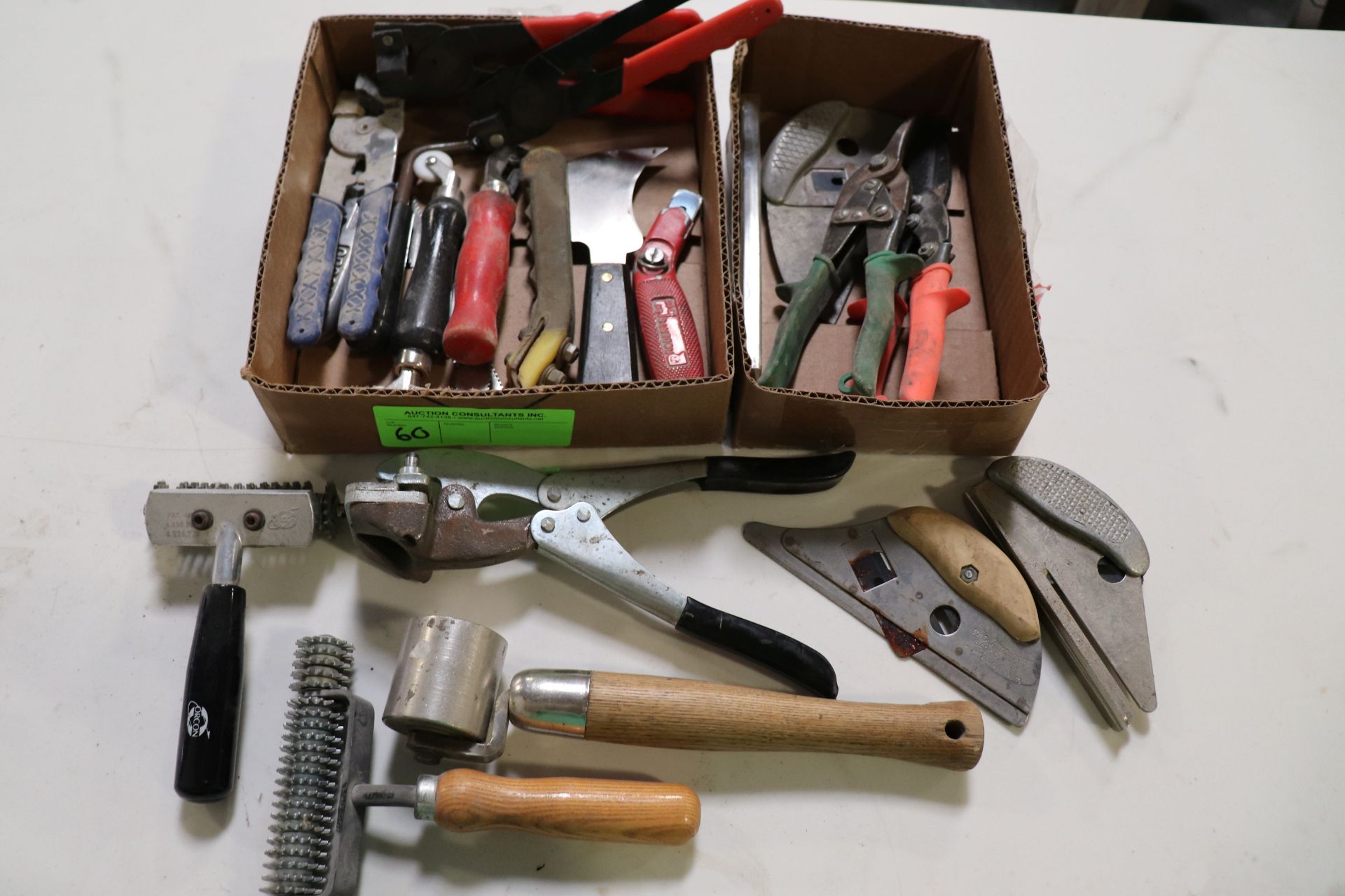 Two boxes of carpet installation tools