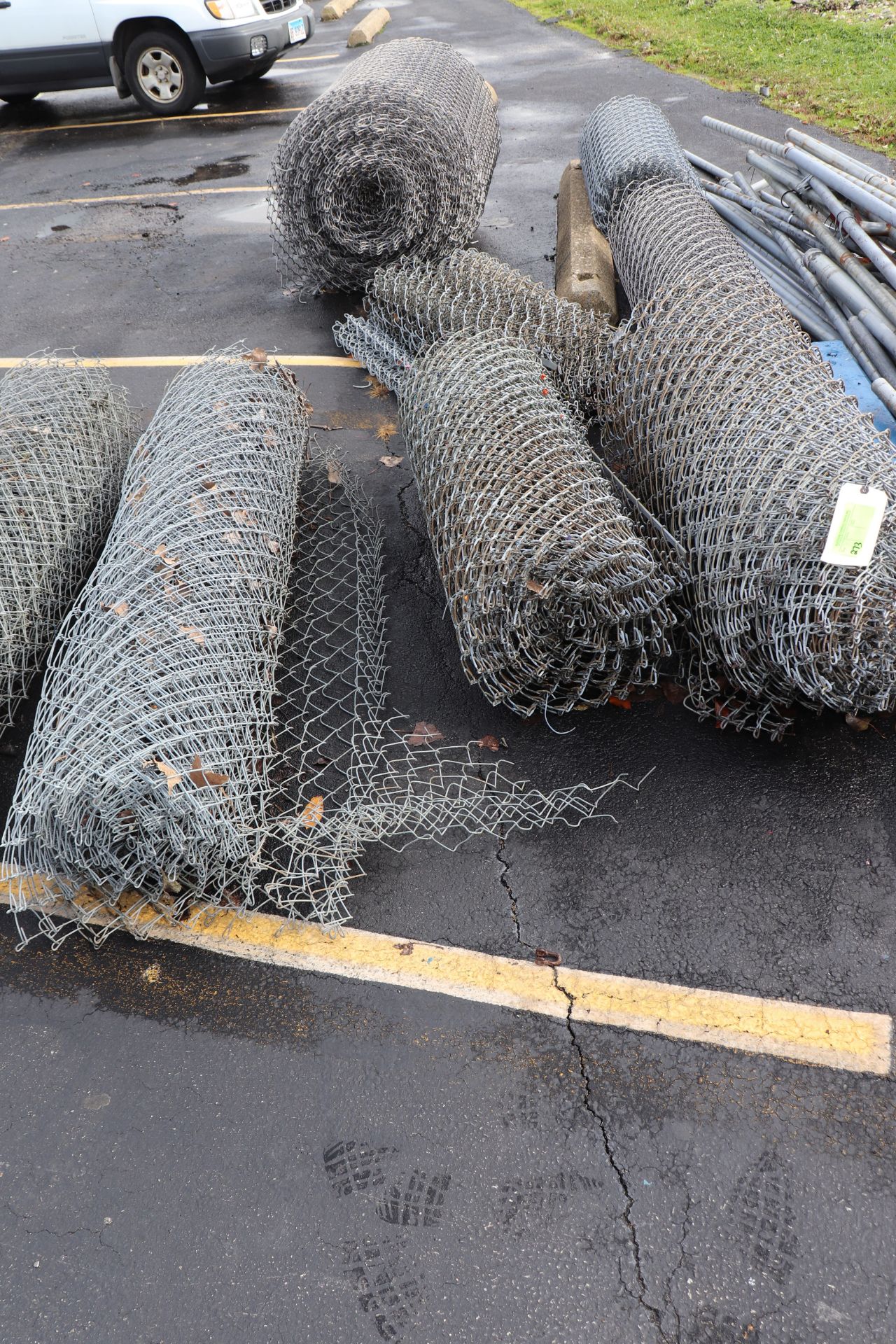 Six rolls of chain link fencing