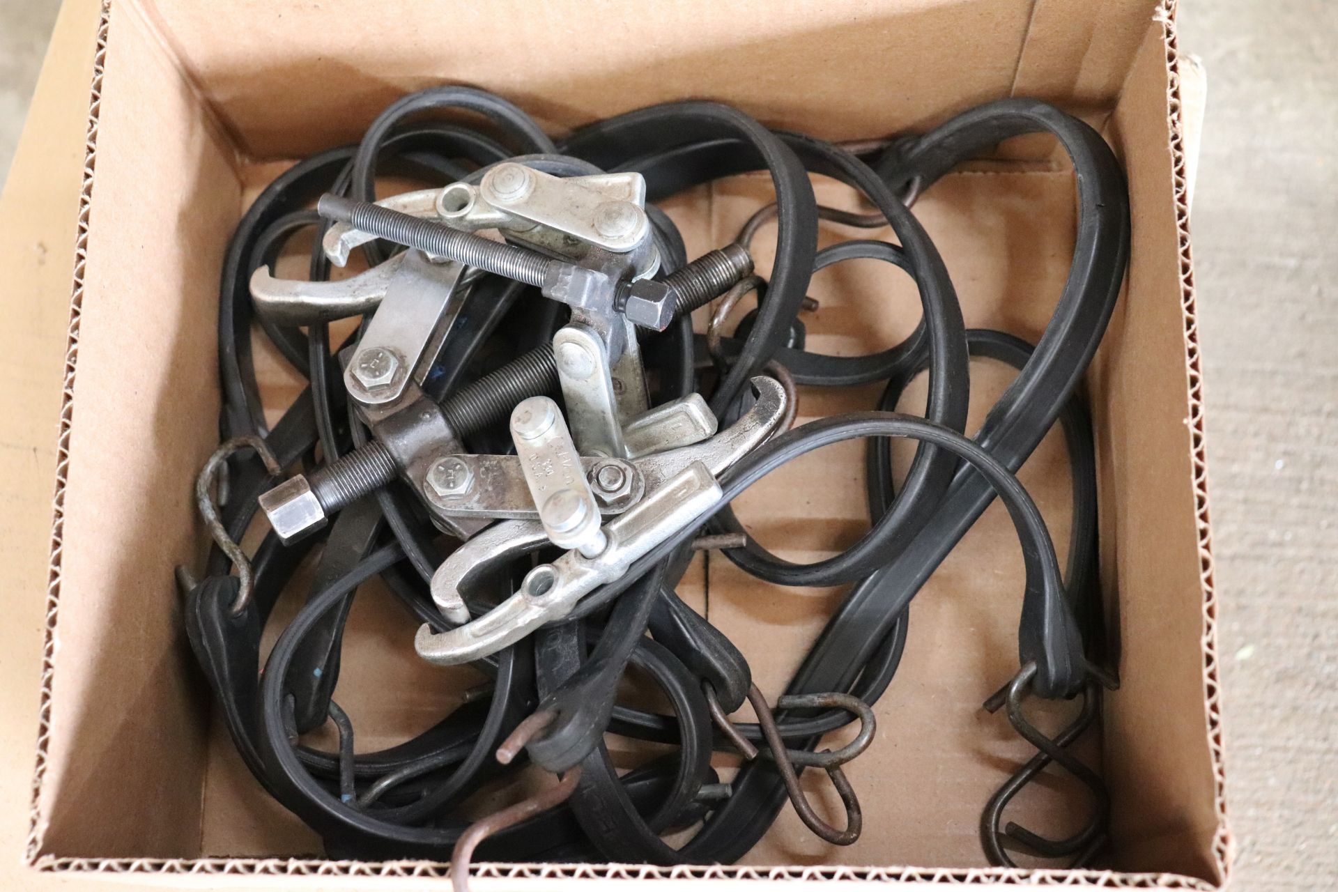 Lot of bungee cords and gear pullers