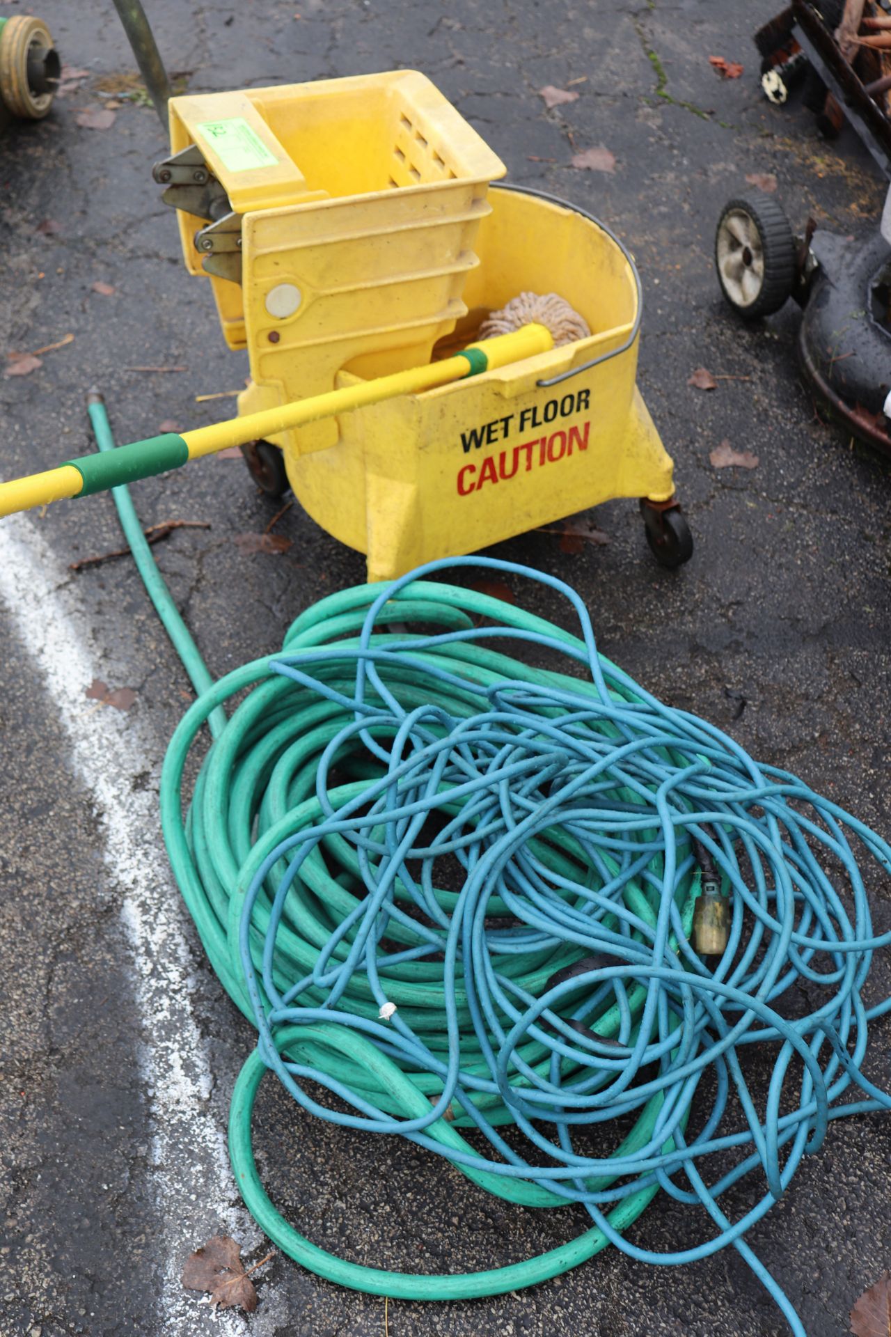 Mop bucket with hose and extension cord