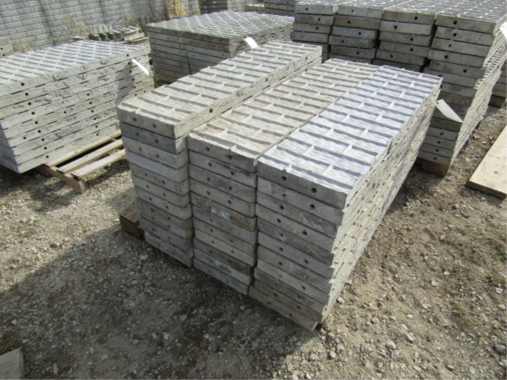 (34) 12" x 4' Precise Concrete Forms, Textured Brick 8" Hole Pattern, Located in Winterset, IA