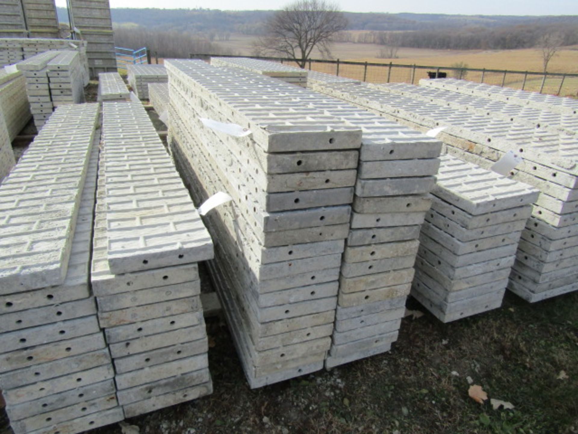(16) 12" x 9' Corners Precise Concrete Forms, Textured Brick 8" Hole Pattern, Located in