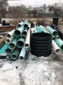 Pile of PVC Pipe and Crate of Fittings