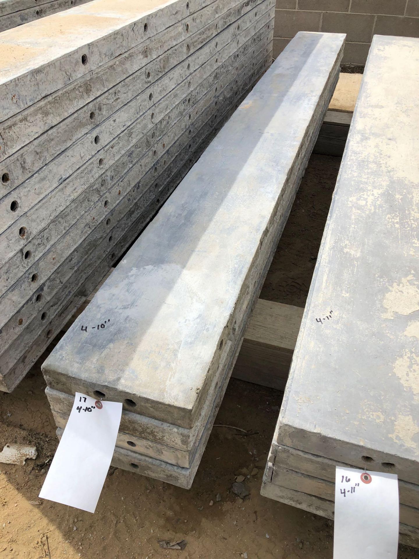 (4) 10" x 8' Wall-Ties Aluminum Concrete Forms, Smooth 6-12 Hole Pattern. Located at 6180 W 10th St,