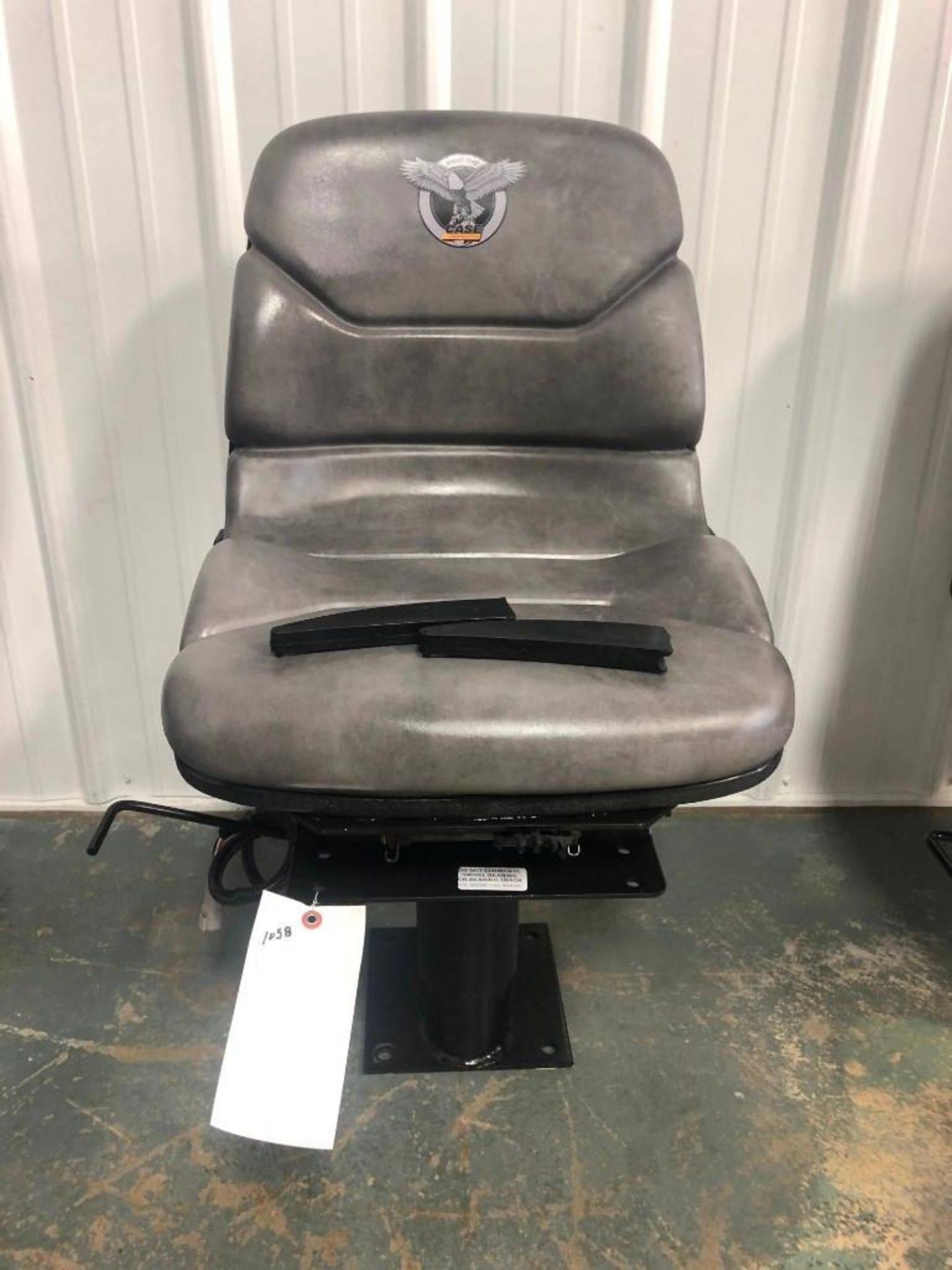 Case Backhoe Seat. Located at 301 E Henry Street, Mt. Pleasant, IA 52641.
