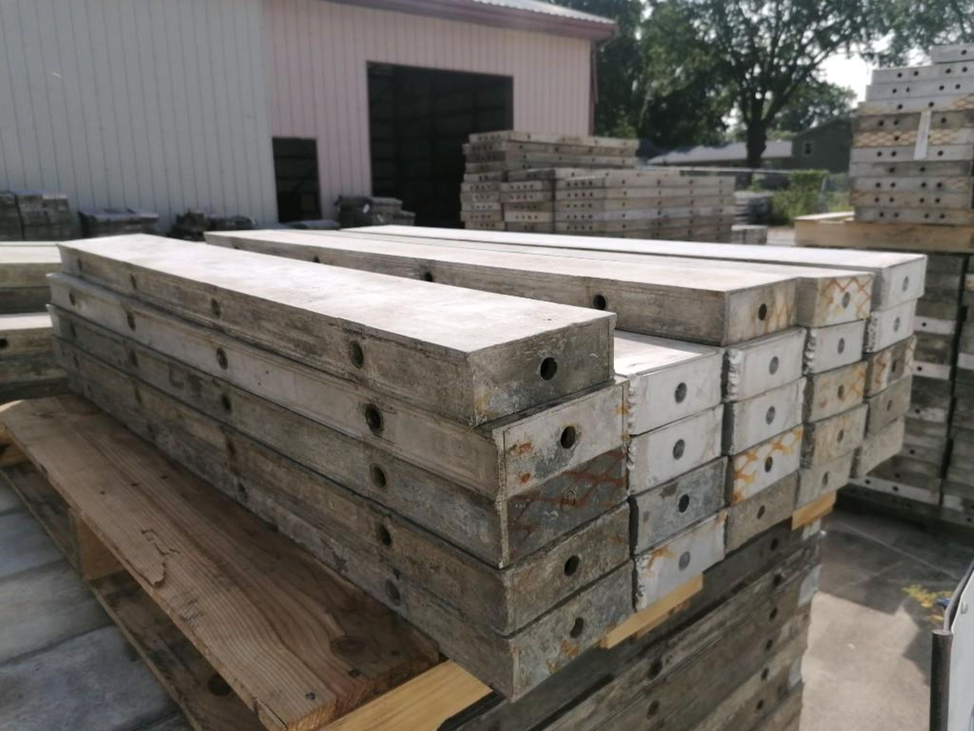 (24) 6" x 4' Wall-Ties Aluminum Concrete Forms, Smooth 6-12 Hole Pattern. Located at 301 E Henry
