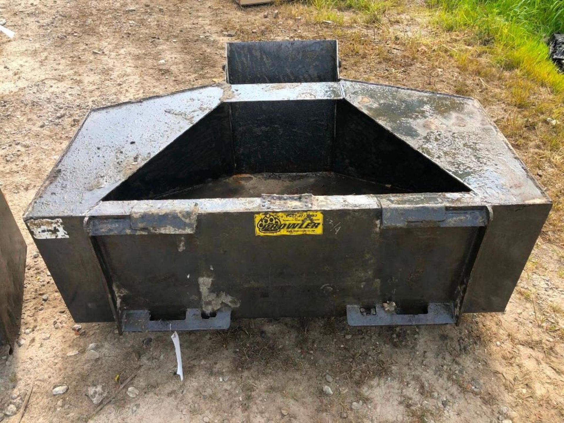 Skidloader Concrete Chute Bucket. Located at 301 E Henry Street, Mt. Pleasant, IA 52641.