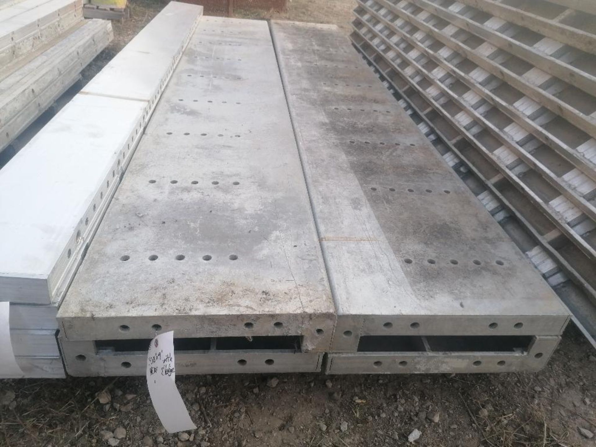 (4) NEW 18" x 9' with 2" Ledge Smooth Aluminum Concrete Forms 6-12 Hole Pattern. Located in