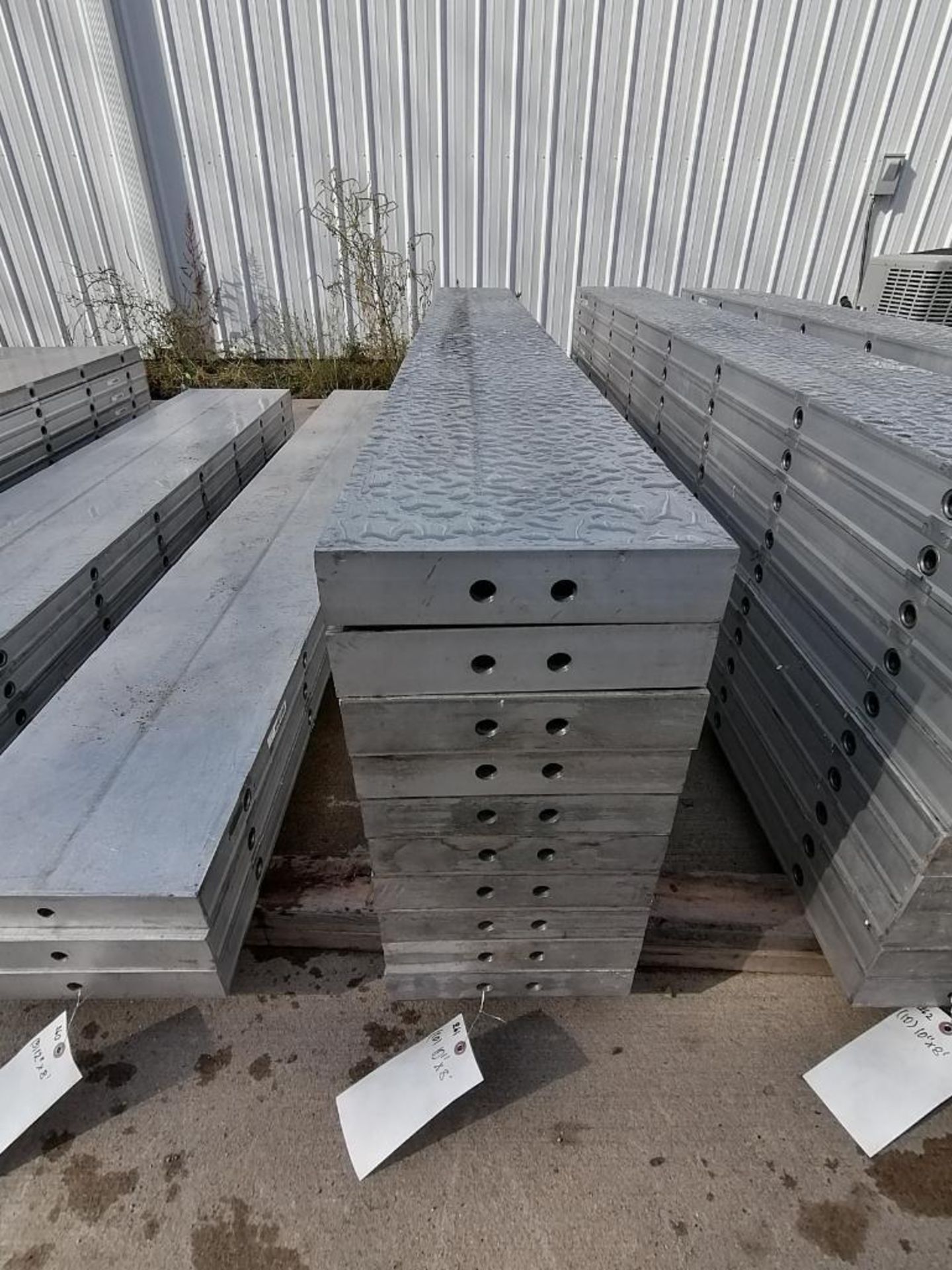 (10) 10" x 8' NEW Badger Smooth Aluminum Concrete Forms 6-12 Hole Pattern. Located in Mt.