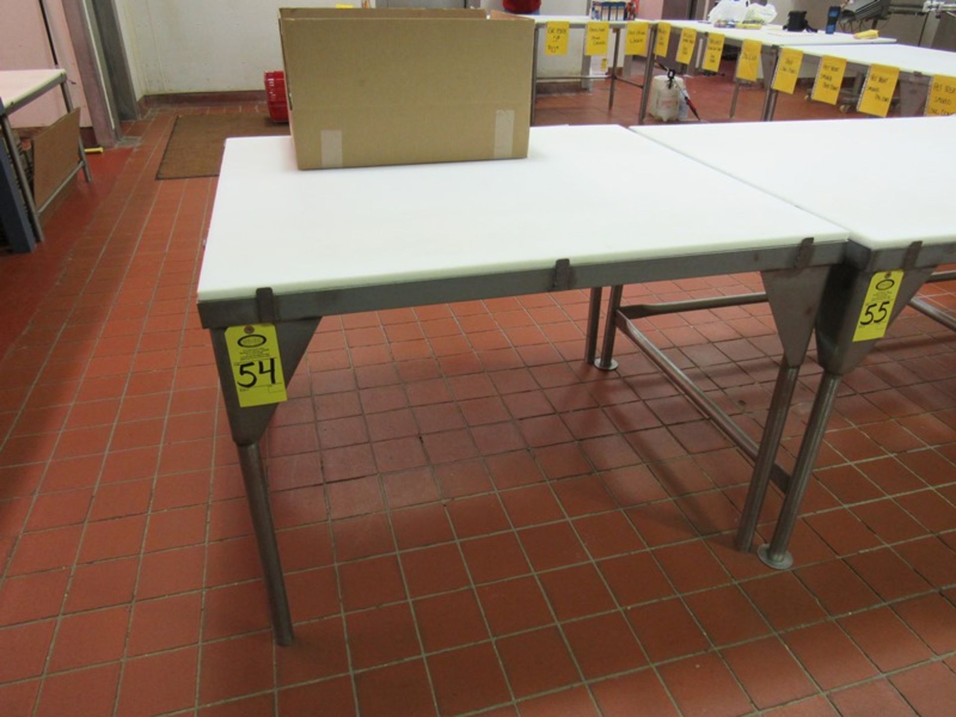 Stainless Steel Table, 42" W X 4'L poly top(Required Loading Fee $10.00 - Small Items Will Be Loaded