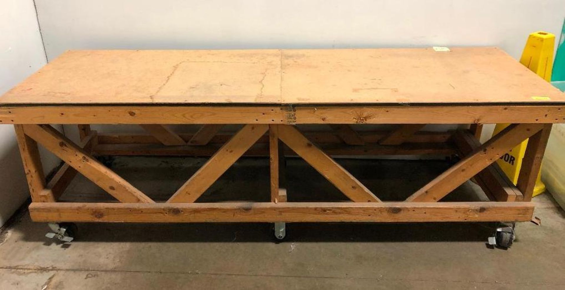 DESCRIPTION 96 IN WOODEN WORK TABLE ON CASTERS SIZE 96 IN X 30 IN X 30 IN LOCATION WAREHOUSE: BAY 1