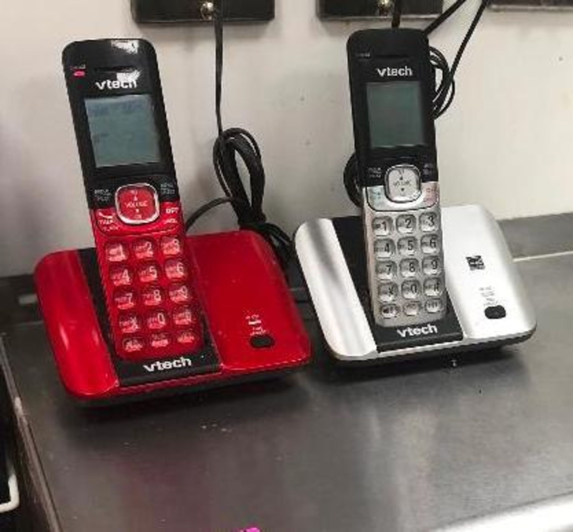 DESCRIPTION: (2) CORDLESS PHONES AND (1) DIGITAL CLOCK LOCATION: KITCHEN THIS LOT IS: ONE MONEY QTY