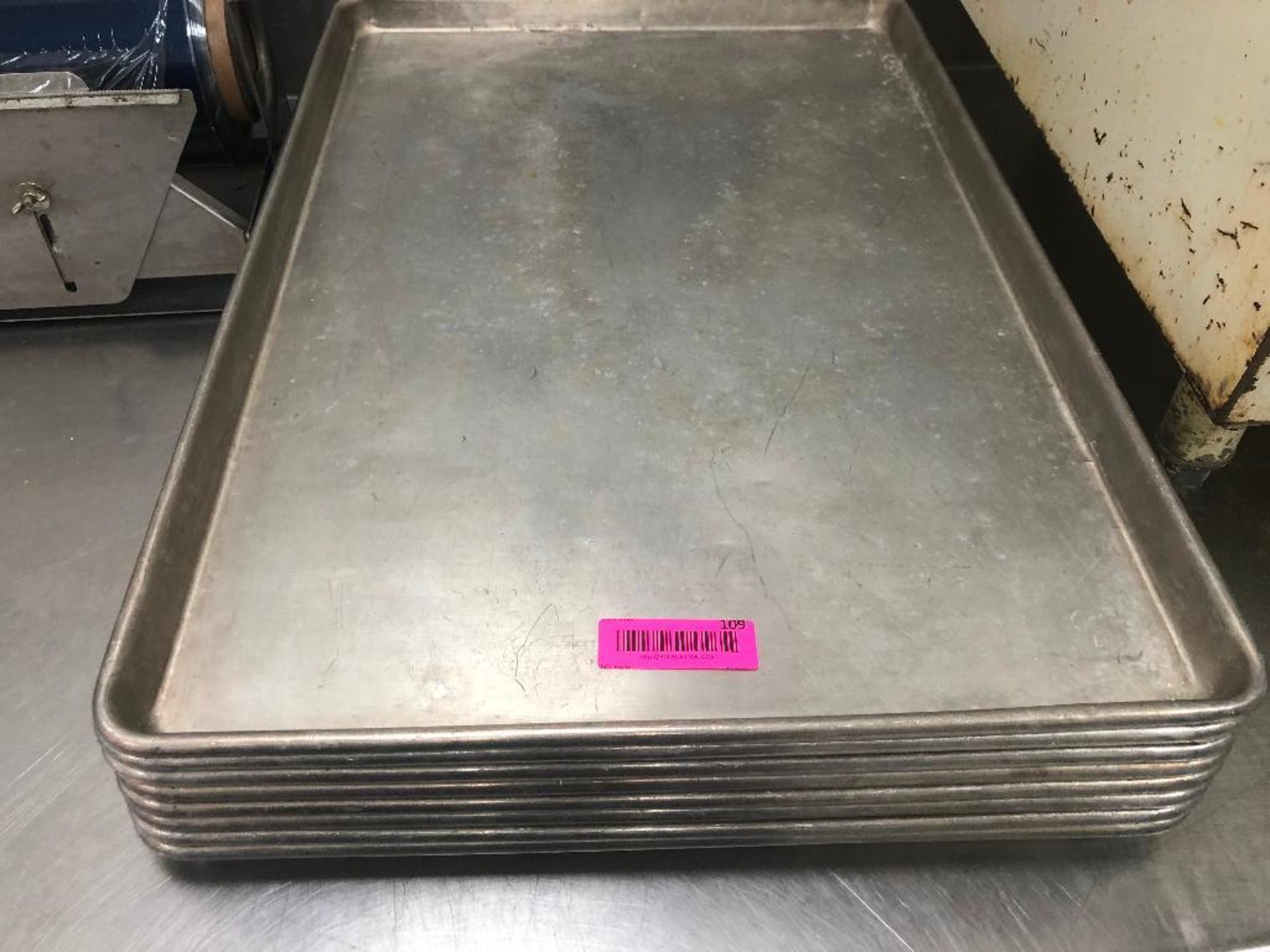 DESCRIPTION: (8) FULL SIZE SHEET PANS. SIZE: FULL SIZE LOCATION: KITCHEN THIS LOT IS: SOLD BY THE PI