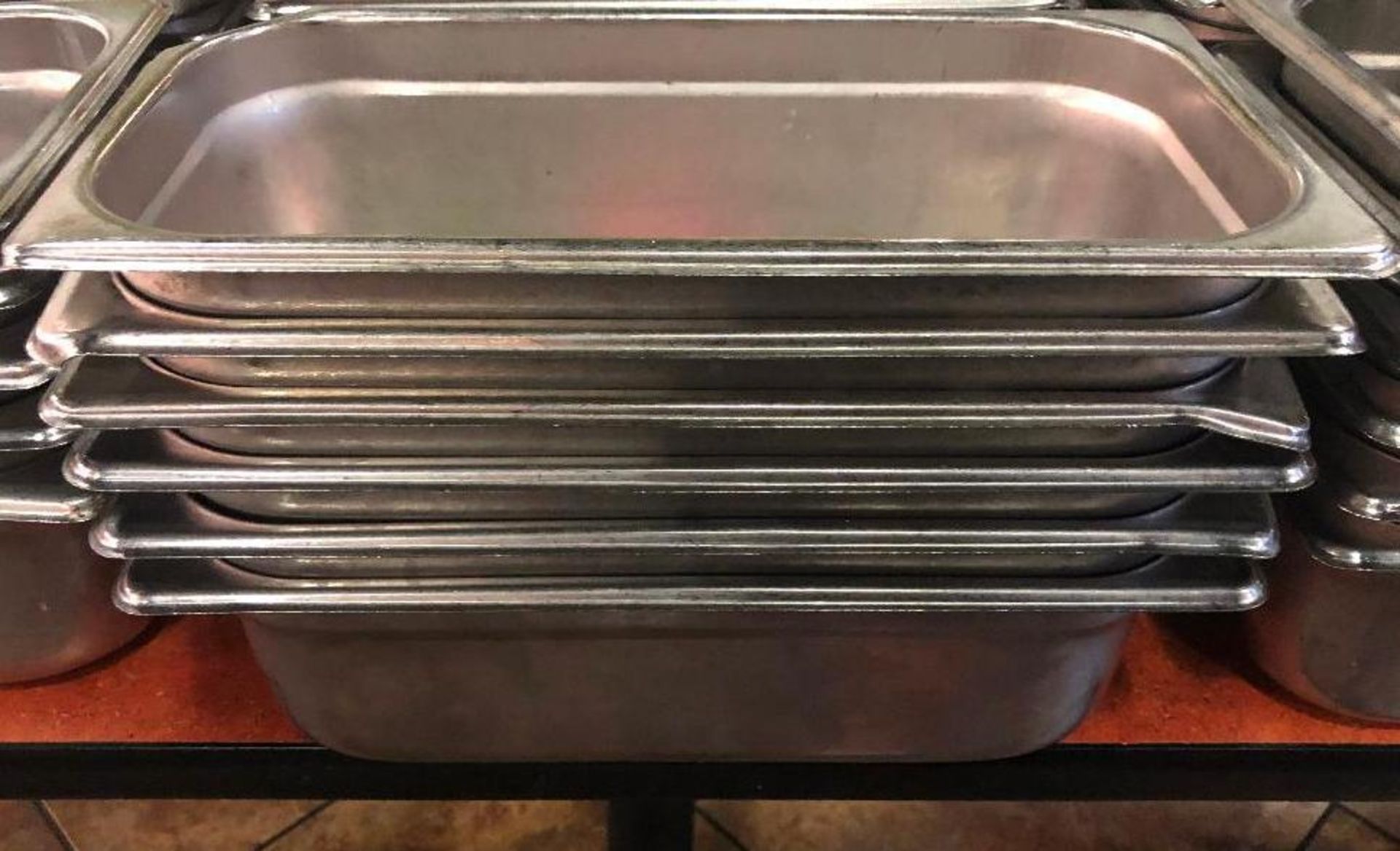 DESCRIPTION: (6) 1/3 SIZE STAINLESS INSERTS. NO LIDS SIZE: 4" DEEP LOCATION: MAIN SEATING THIS LOT I