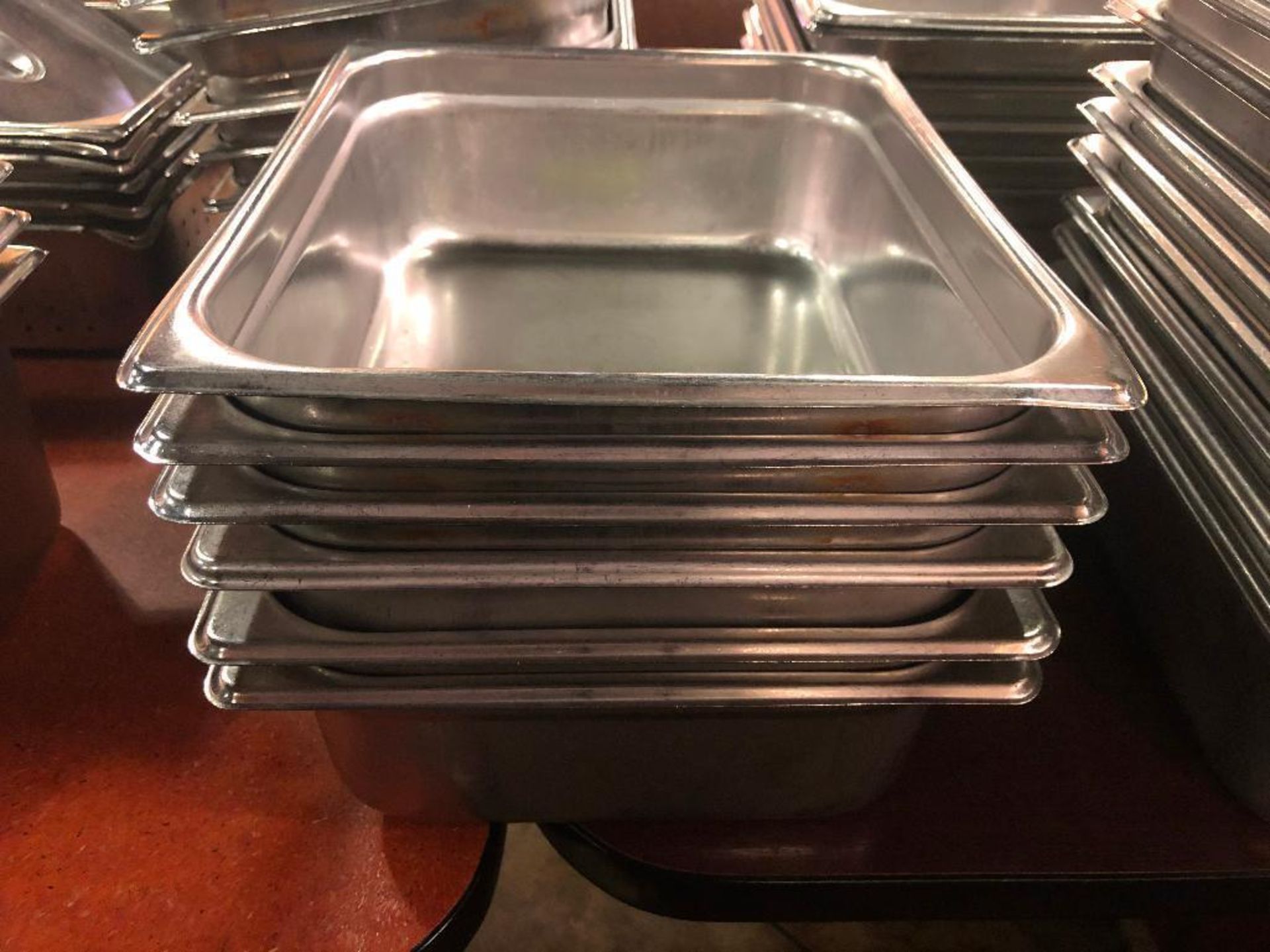 DESCRIPTION: (6) HALF SIZE STAINLESS INSERTS. NO LIDS SIZE: 4" DEEP LOCATION: MAIN SEATING THIS LOT