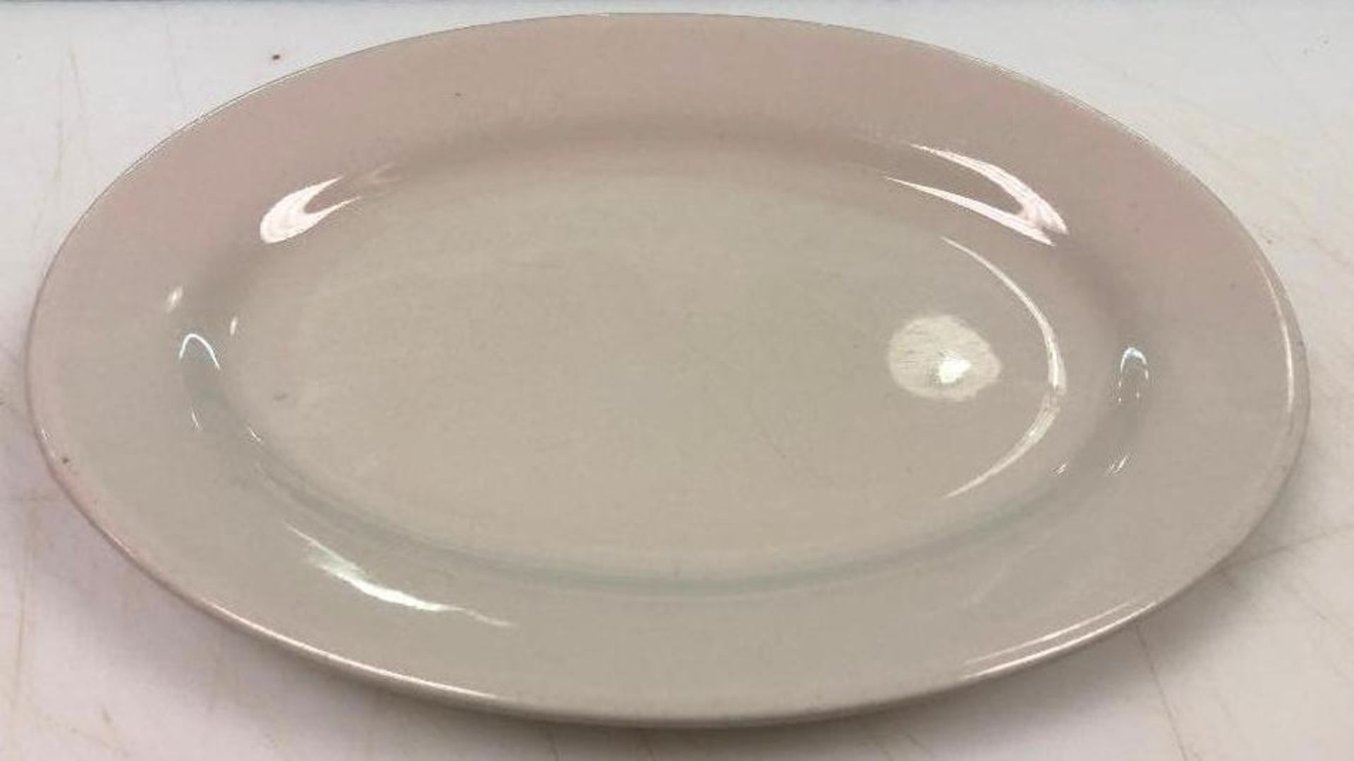 DESCRIPTION: (12) 10.25" CHINA PLATTERS SIZE: 10.25" LOCATION: KITCHEN THIS LOT IS: SOLD BY THE PIEC