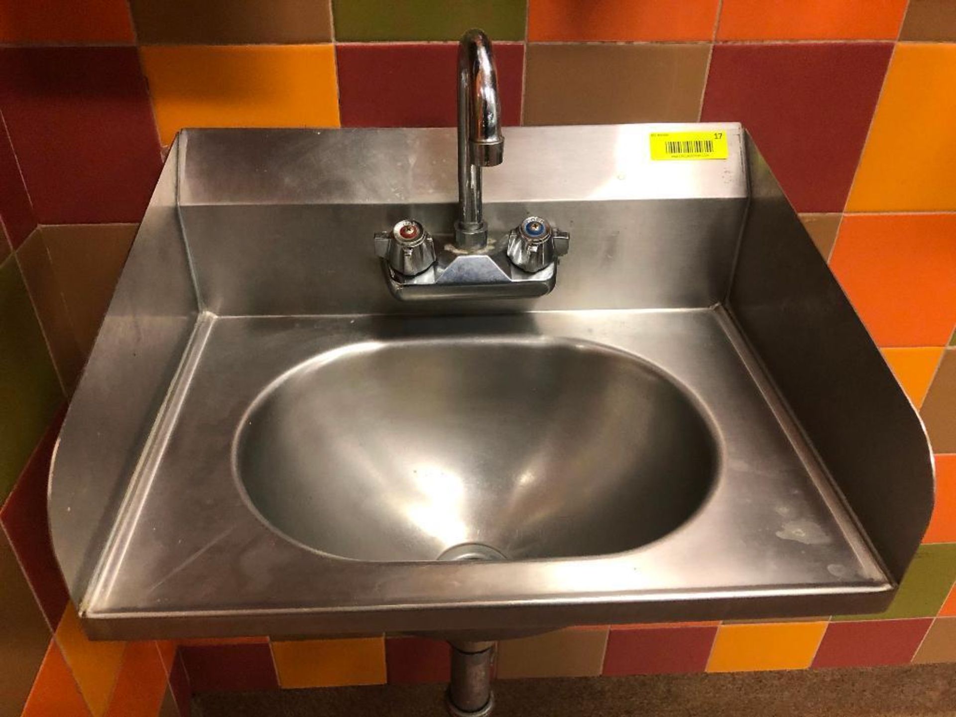 DESCRIPTION: WALL MOUNTED STAINLESS HAND SINK. ADDITIONAL INFORMATION: W/ WALL MOUNTED TOWEL AND SOA